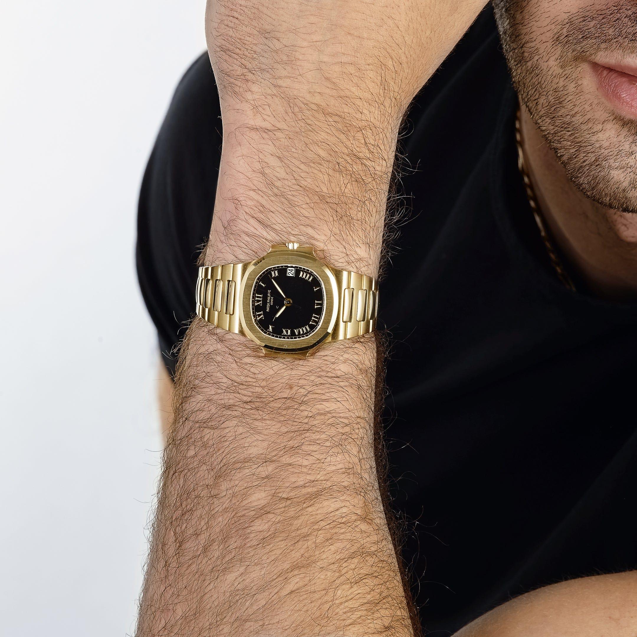 The Patek Philippe Nautilus 3800/1J-017 in yellow gold is a stunning timepiece that combines the elegance of precious materials with the iconic design of the Nautilus collection. Its 37.5mm case features the signature rounded octagonal bezel and