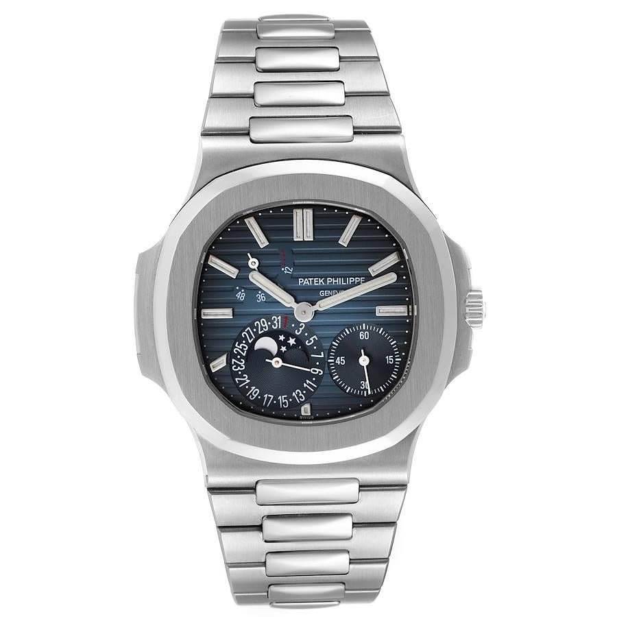 Patek Philippe Nautilus Blue Dial Moonphase Steel Mens Watch 5712 Box Papers. Automatic self-winding movement. Stainless steel coushion shape case 40.0 x 40.0 mm. Exhibition sapphire crystal caseback. Stainelss steel smooth bezel. Scratch resistant