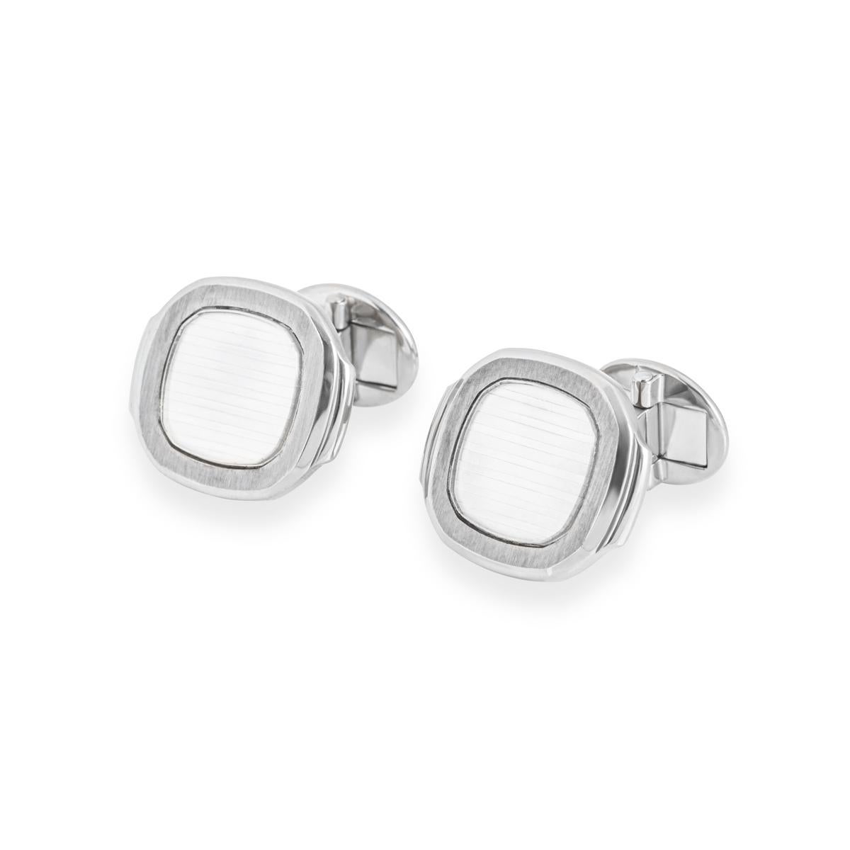 A stylish pair of 18k white gold cufflinks by Patek Philippe from the Nautilus collection. The cufflinks are set with a silvery-white Nautilus panel surrounded by a satin finish border. The cufflinks measure 2.2 cm in length, 1.9 cm in width and