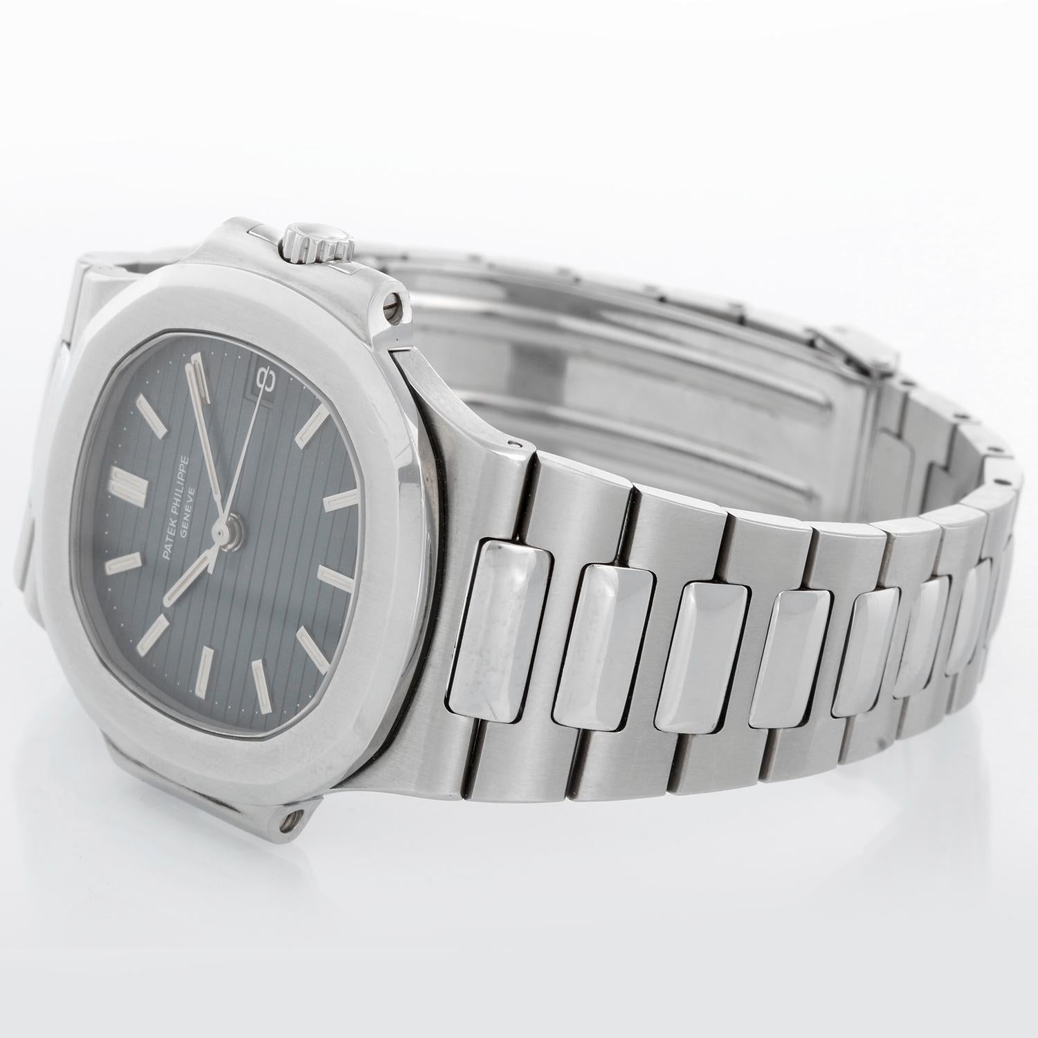 Patek Philippe Nautilus Men's Stainless Steel 38mm Watch 3800 - Automatic winding. Stainless steel case (38mm x 43mm). Gray-blue dial with stick markers; date at 3 o'clock. Stainless steel Nautilus bracelet. From original owners family. It has only 