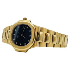 Patek Philippe Nautilus Model 4700 26mm in 18k gold with diamonds