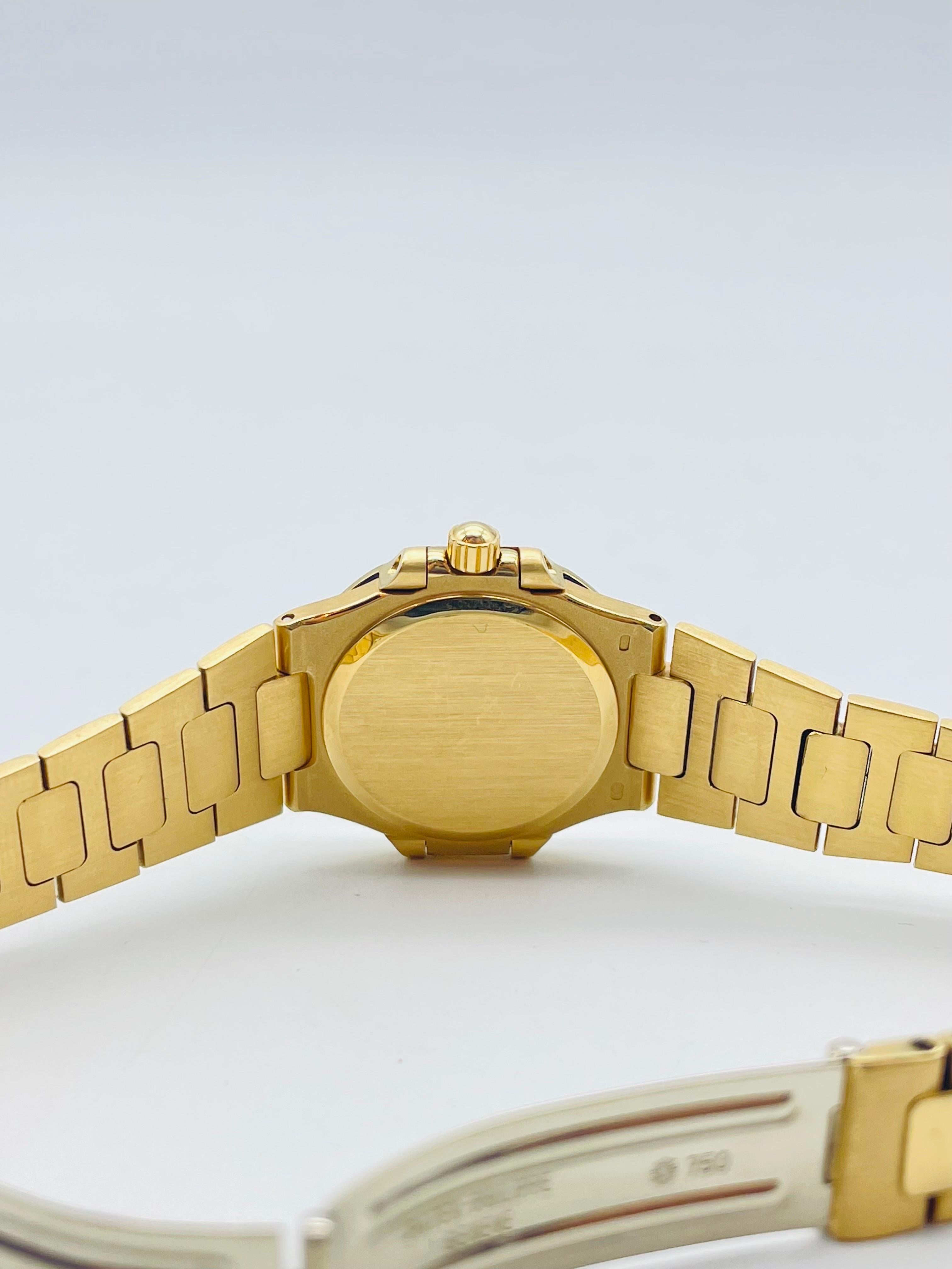 Women's or Men's Patek Philippe Nautilus Model 4700 26mm in 18k gold with diamonds 