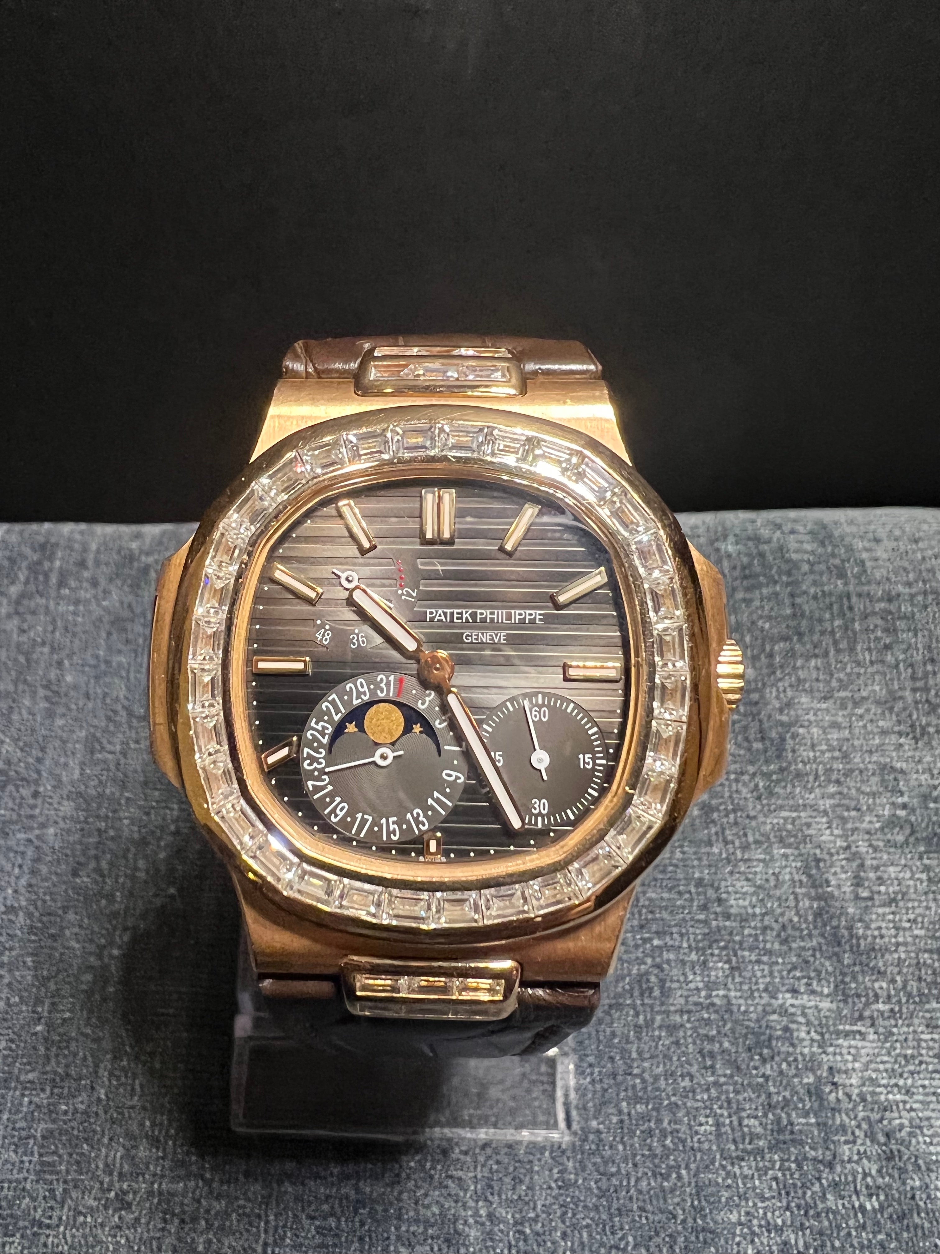 Patek Philippe Nautilus Moon Phase with Baguette Diamonds, Display Back under Sapphire & Micro-Rotor

Brand: Patek Philippe 
Model: Nautilus 5724R
Case Diameter: 40mm
Movement: Automatic
Caliber: 240 PS IRM C LU
Number of Jewels: 29
Case: 18K Rose