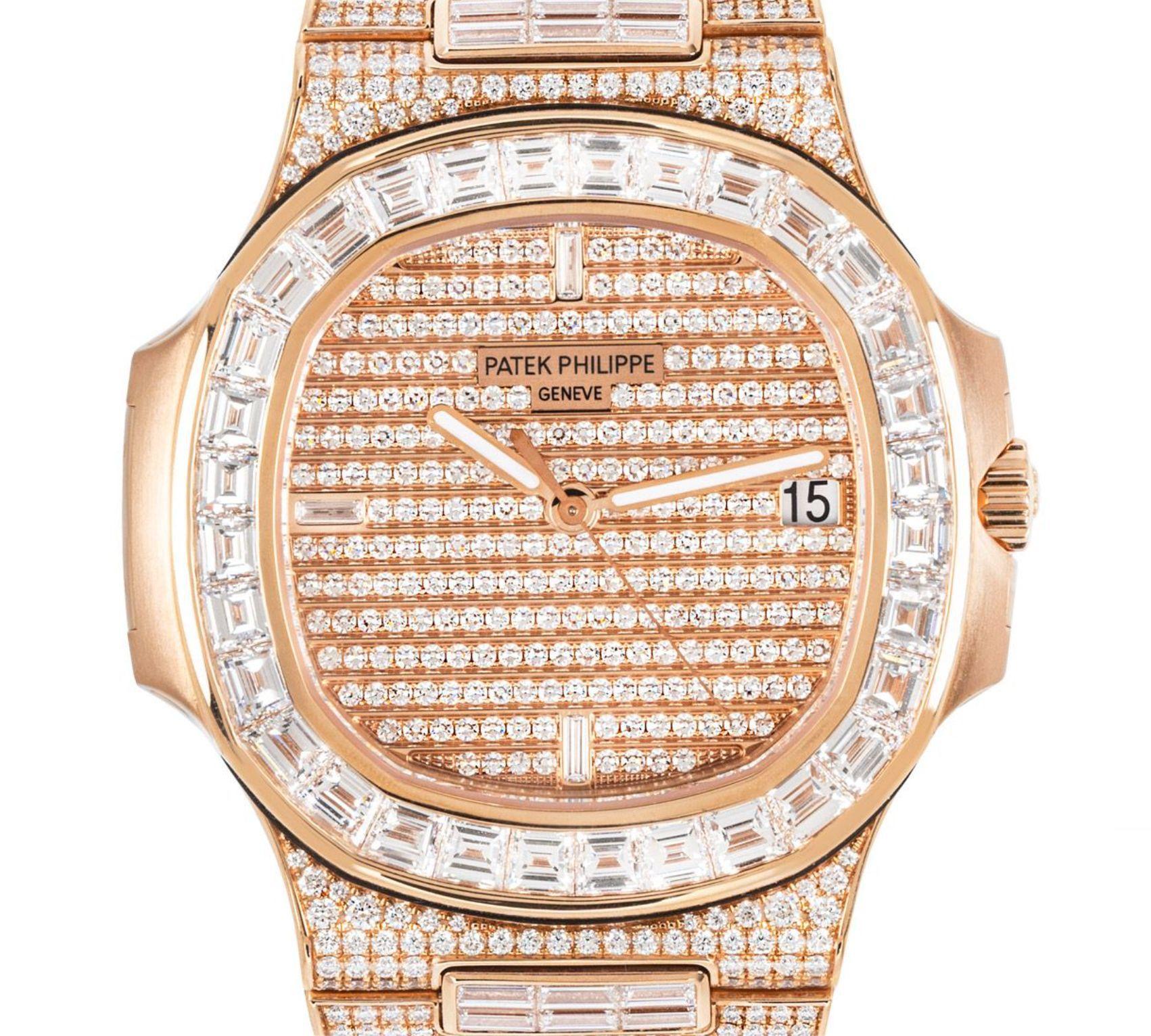 An unworn mens Nautilus wristwatch crafted in rose gold by Patek Philippe. Featuring a stunning pave diamond dial with 3 baguette cut hour markers and a date aperture. Complimenting the dial is a fixed rose gold bezel set with baguette cut