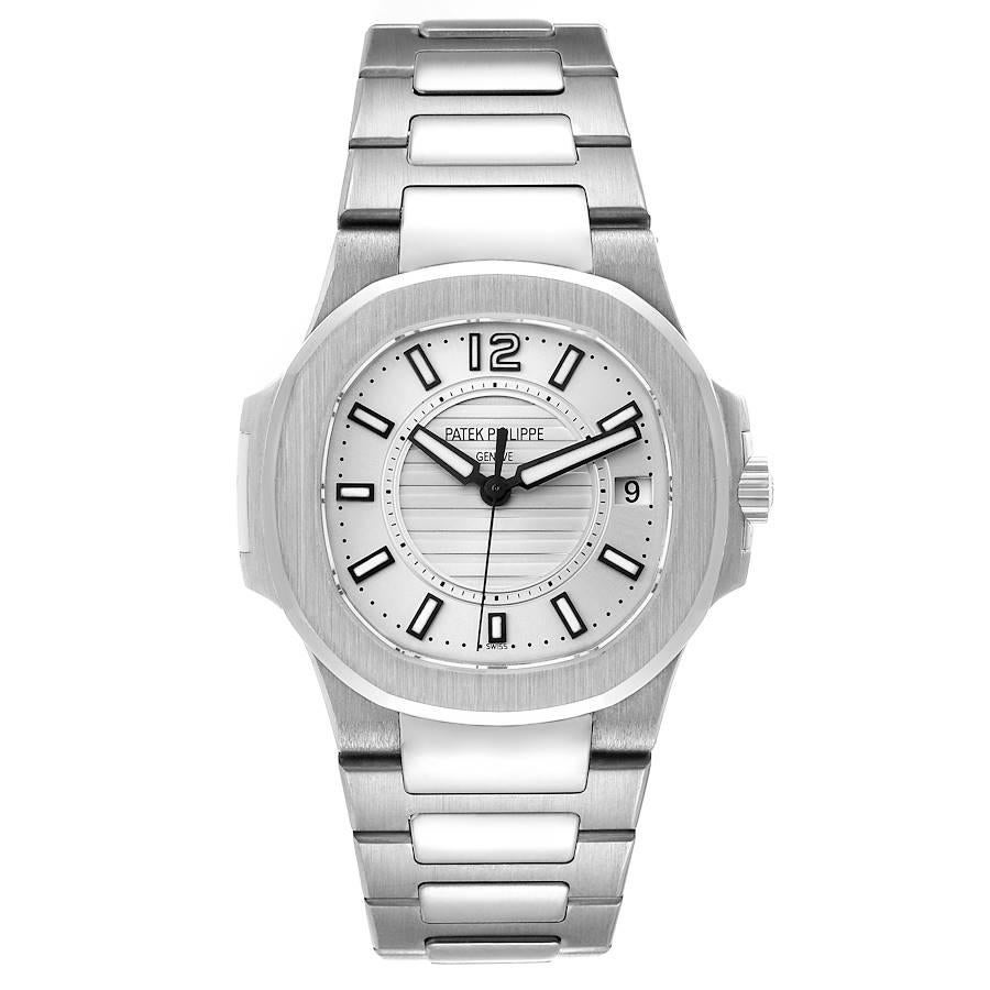 Patek Philippe Nautilus White Gold Silver Dial Ladies Watch 7011. Quartz movement. 32mm 18K white gold cushion case. Patek Philippe logo on the crown. 18K white gold brushed bezel. Scratch resistant sapphire crystal. Silver dial with luminous hands