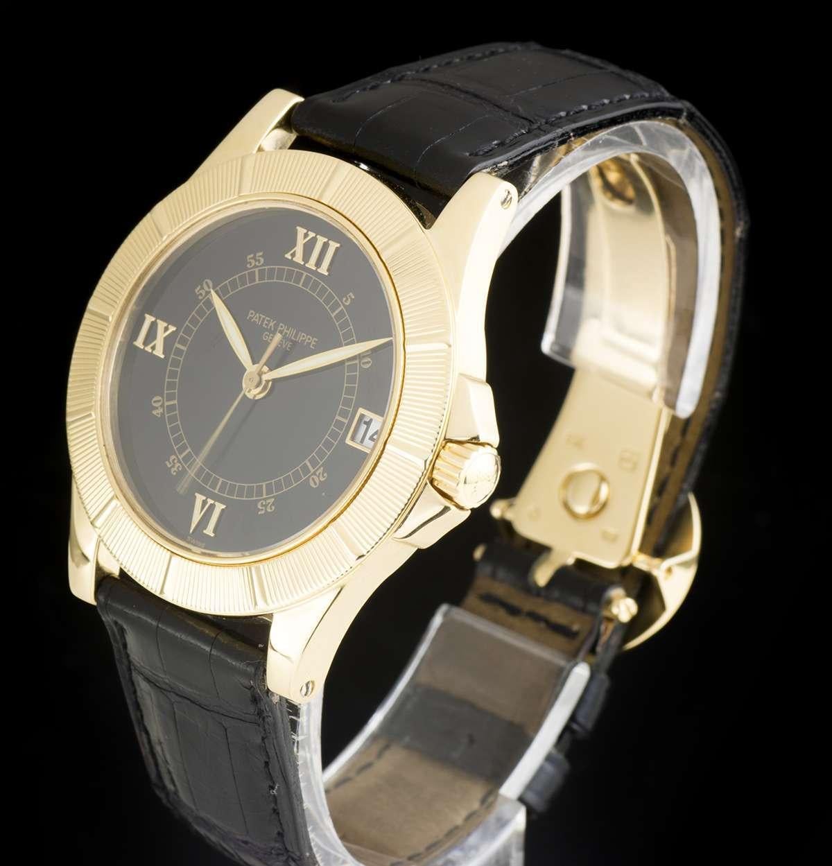An 18k Yellow Gold Neptune Gents Wristwatch, black dial with applied roman numerals at 3, 6, 9 and 12 0'clock, date at 3 0'clock, a fixed 18k yellow gold bezel, an original black leather strap with an original 18k yellow gold deployant clasp,