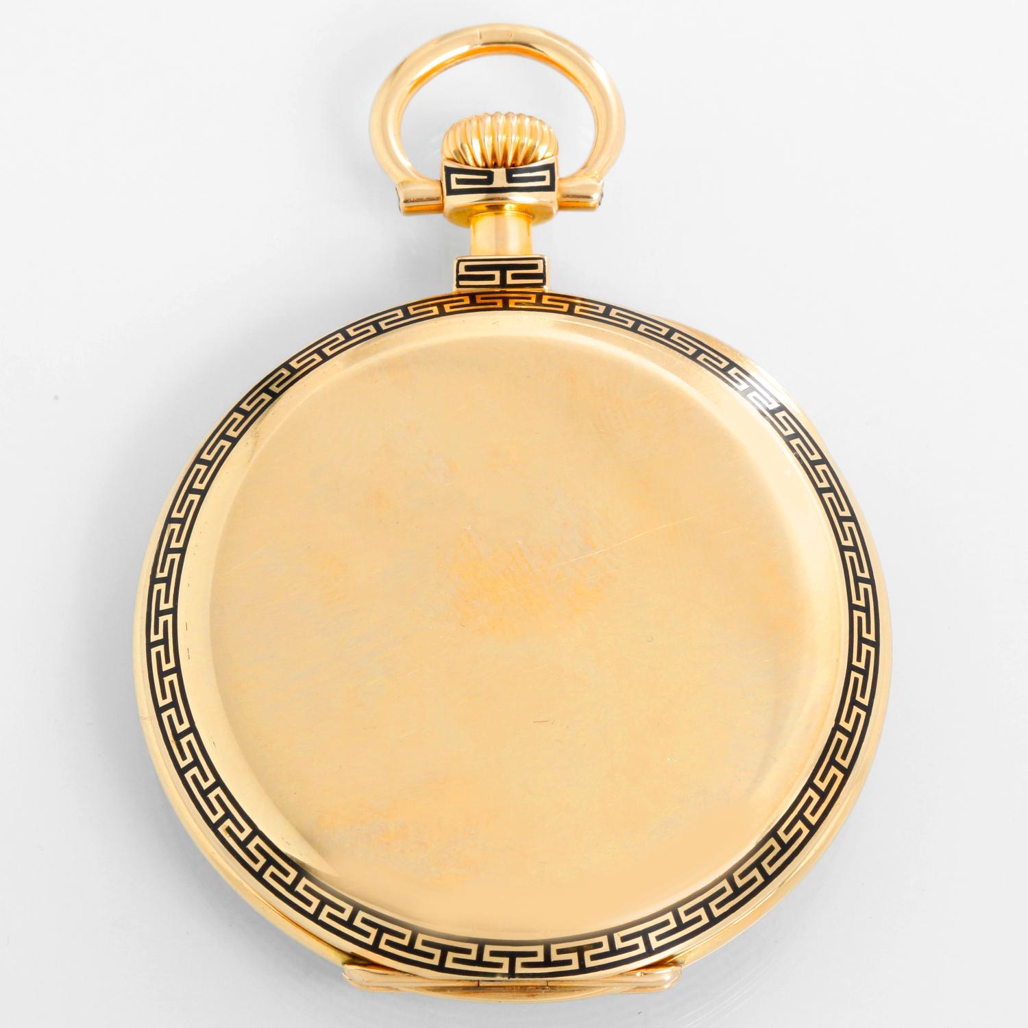 Patek Philippe Open Face 18K Yellow Gold Pocket Watch - Manual winding. 18K Yellow Gold ( 48 mm ) with Greek key black enameling to bezel rear perimeter and pendant, initials to rear, gold cuvette with signature ring. Cream colored enamel stainless