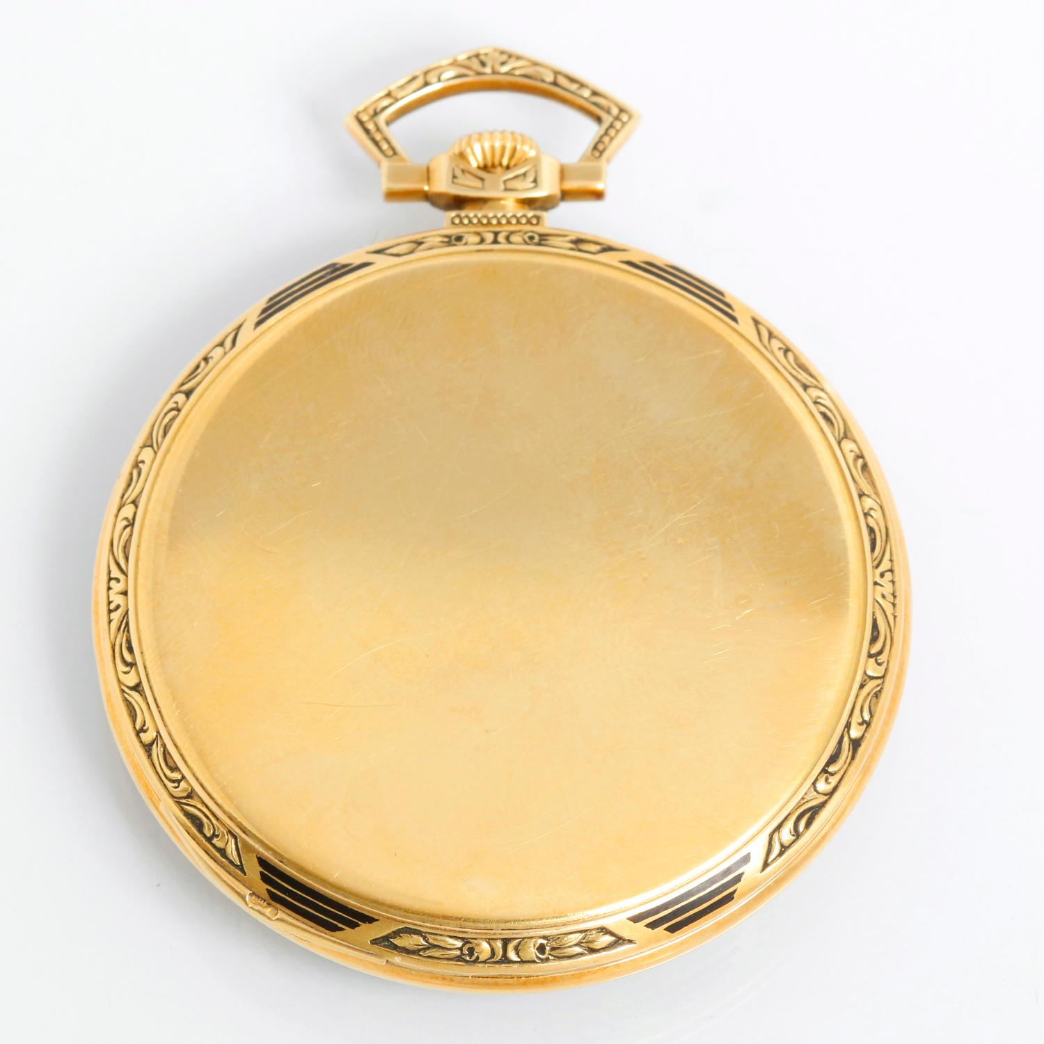 Patek Philippe Open Face 18K  Yellow Gold Pocket Watch - Manual winding. 18K Yellow Gold Case. Signed Patek Philippe & Co. ( 45 mm ) with black enamel. Silver dial with Arabic raised numbers; subdial at 6 o'clock. Pre-owned with original Patek box