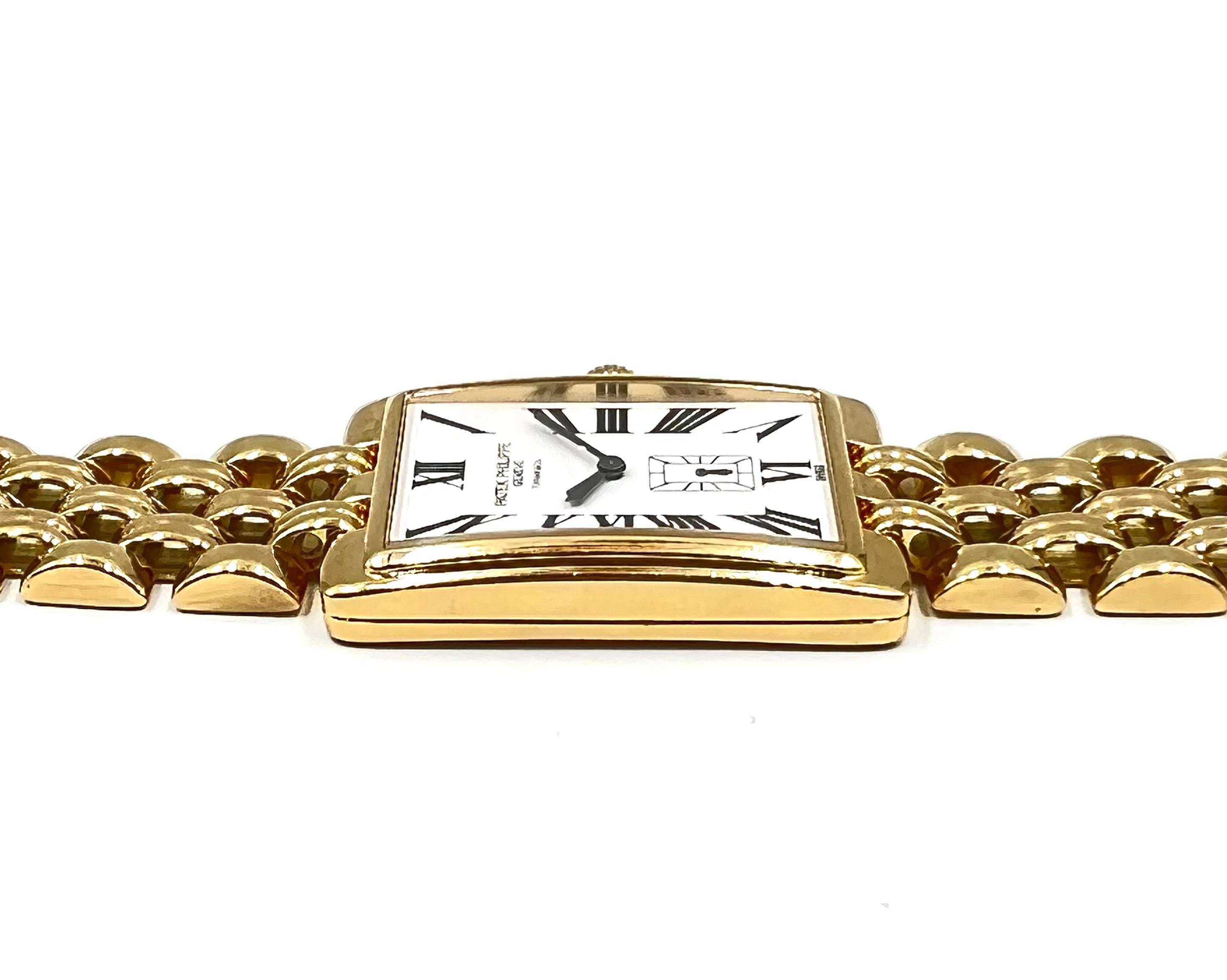 Vintage Patek Philippe men's Gondolo wristwatch (ref. 5009/1J, featuring a mechanical manual wind movement; white dial signed TIFFANY & CO with painted black Roman numerals; small seconds subdial at 6 o'clock; and 26 x 39mm, rectangular 18k yellow