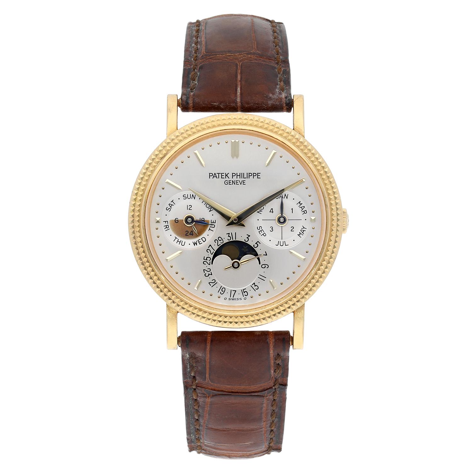 Preowned, excellent condition Patek Philippe reference 5039J-014 Perpetual Calendar Moonphase 18k Yellow Gold gents wristwatch. Argent dial, baton hour markers, month and leap year indicator at 3 o'clock, date and moonphase display at 6 o'clock, day