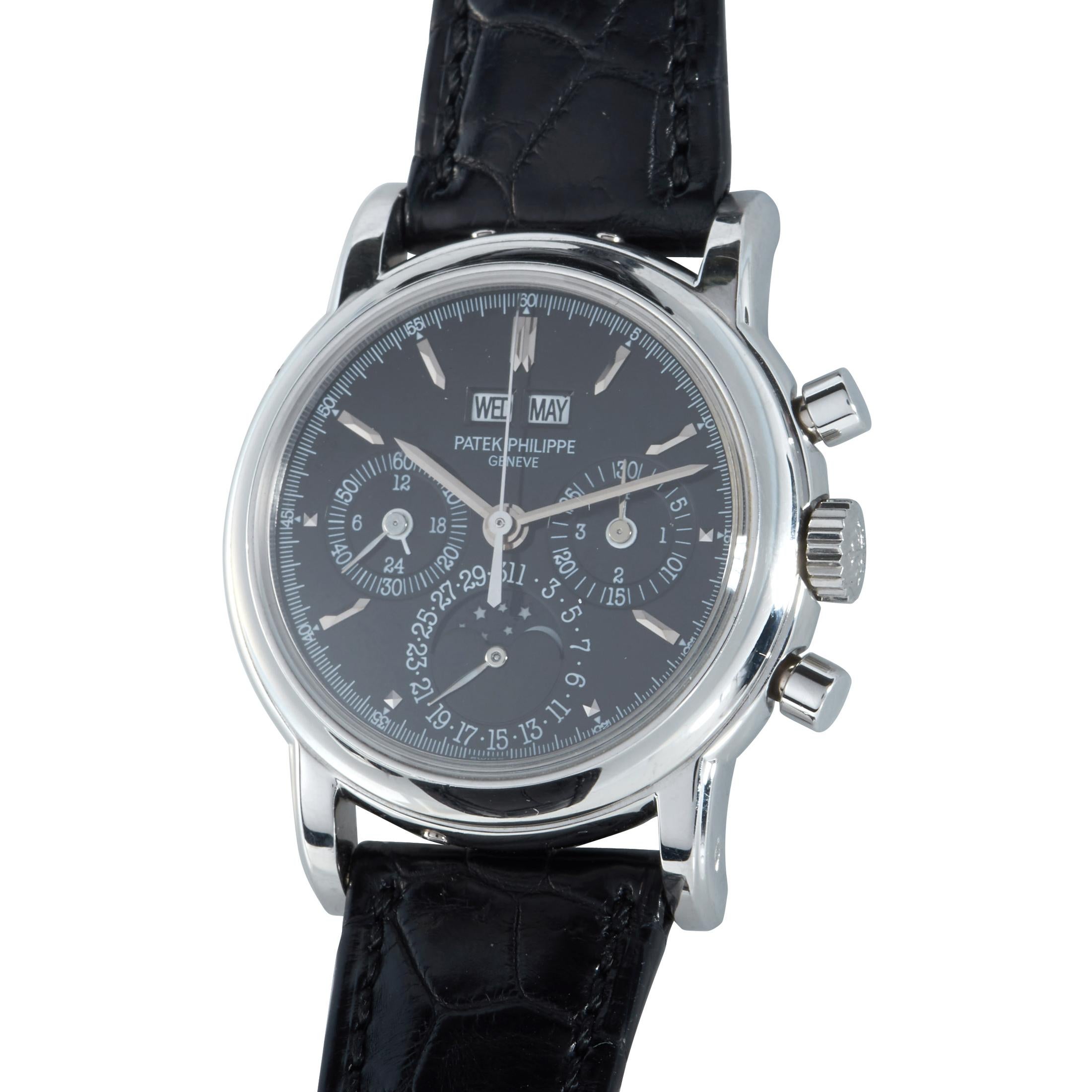 This is the Patek Philippe Perpetual Calendar Chronograph, reference number 3970E.

The watch is presented with a 36 mm platinum case that boasts see-through back that can be covered. The case is mounted onto a black leather strap fitted with a