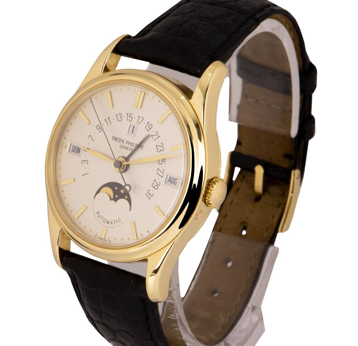 A 36 mm 18k Yellow Gold Perpetual Calendar Retrograde Gents Wristwatch, silver dial with applied hour markers, retrograde date indicator, month at 3 0'clock, moonphase display at 6 0'clock, day at 9 0'clock, leap year at 12 0'clock, a fixed 18k