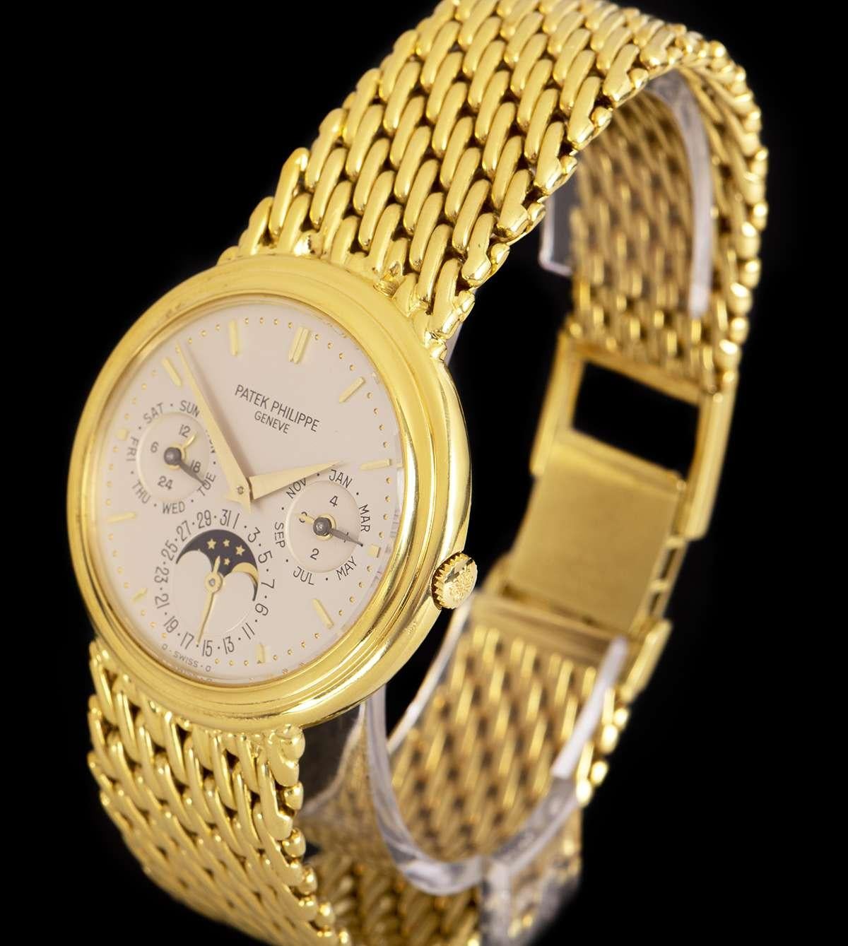 An 18k Yellow Gold Perpetual Calendar Gents Wristwatch, silvered opaline dial with applied hour markers, month and leap year sub-dial at 3 0'clock, date and moonphase display at 6 0'clock, weekday and 24 hour sub-dial at 9 0'clock, a fixed 18k