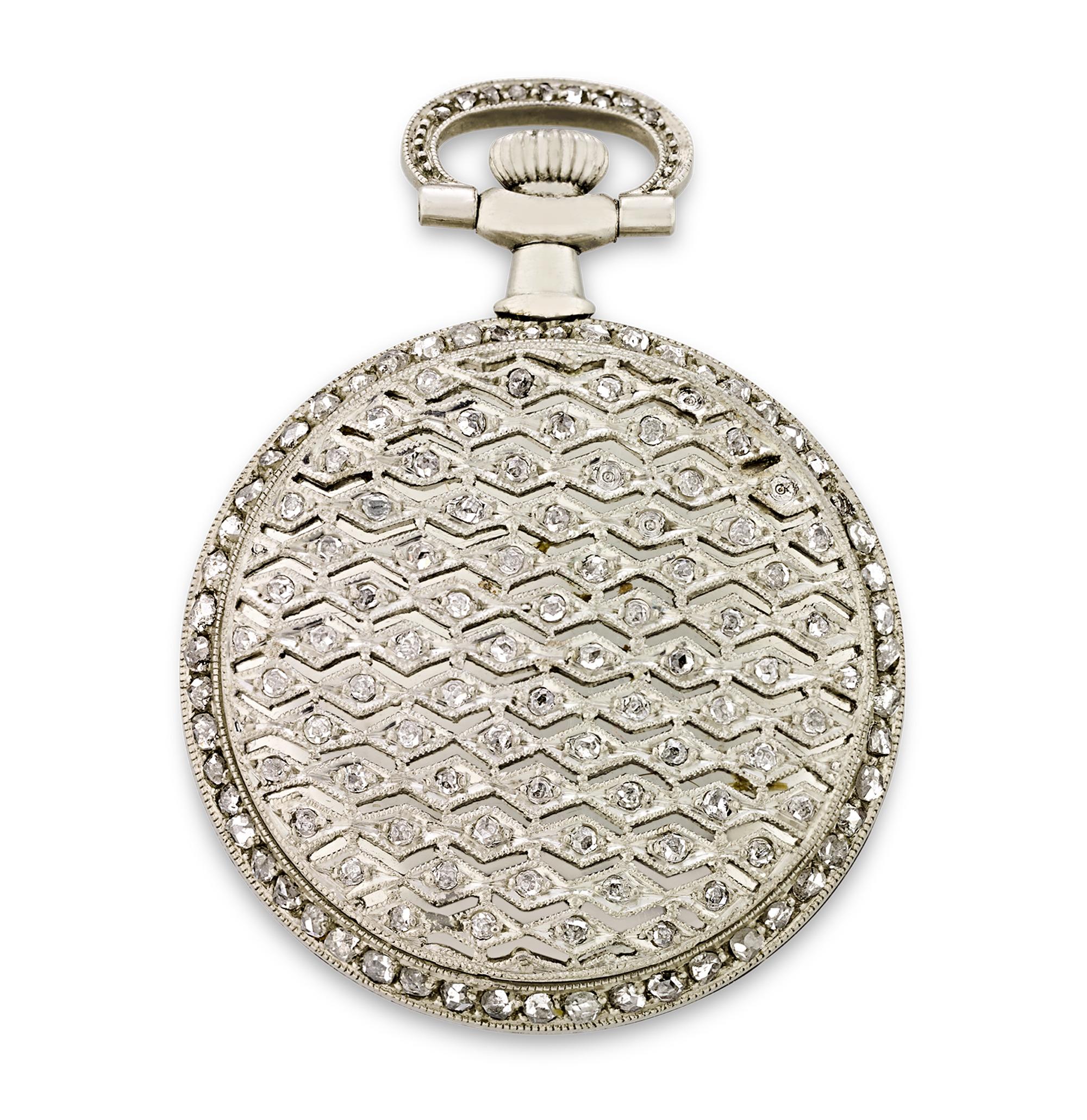 This distinguished 1912 Patek Philippe platinum pendant or pocket watch showcases precision timekeeping at its finest. The open-face watch displays a delicate lace-like design on the caseback, set with shining diamonds. The wreath-engraved bezel