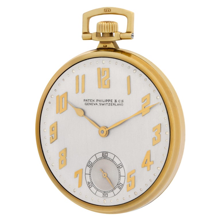 Patek Philippe pocket watch in 18k high polish yellow gold. Watch dial features gold applied Arabic numeral markers and sub-second dial. Manual wind. 42 mm case size. Circa 1926. Includes archive papers. Fine Pre-owned Patek Philippe Watch.