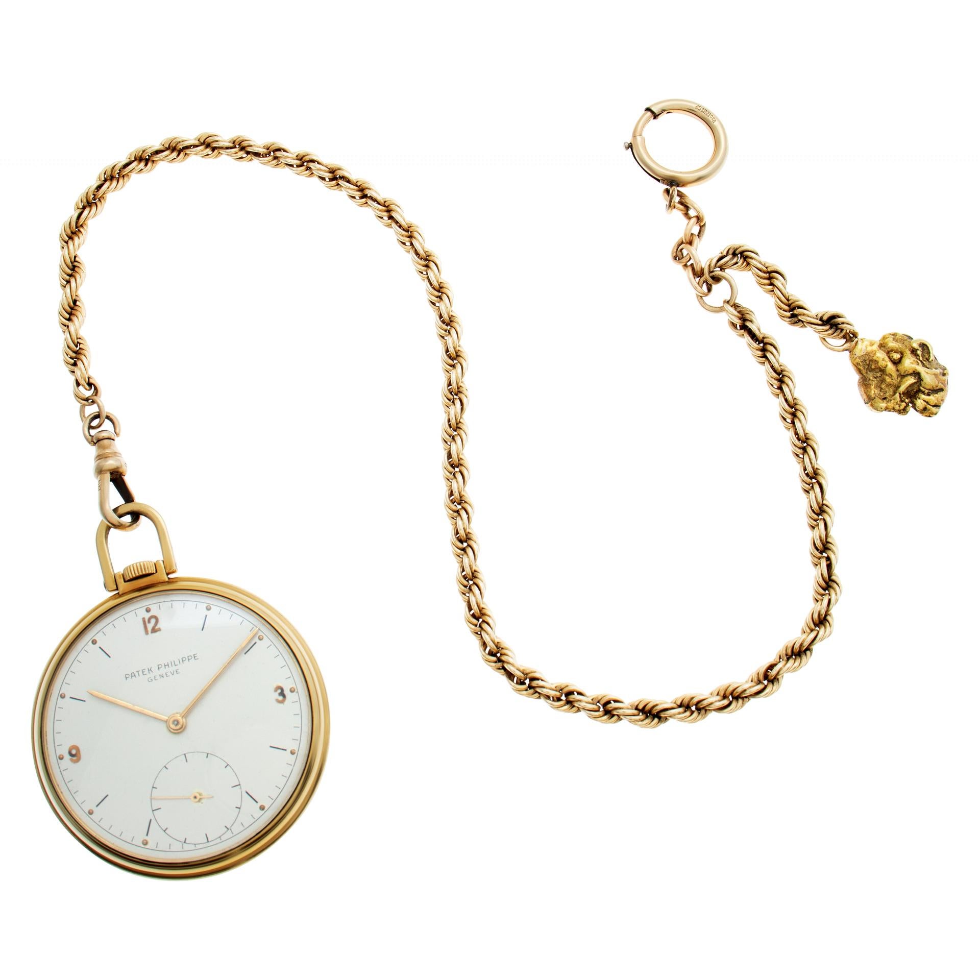 Patek Philippe pocket watch in 18k yellow gold. Manual w/ subseconds. 45 mm case size. Comes with a 14k chain with gold nugget on the end. Fine Pre-owned Patek Philippe Watch. Certified preowned Vintage Patek Philippe pocket watch 726 watch is made