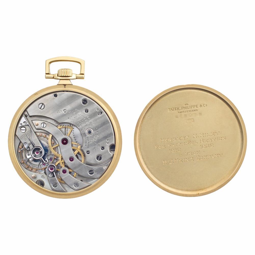 Patek Philippe pocket watch in 18k high polish yellow gold. Watch dial features gold applied Arabic numeral markers and sub-second dial. Manual wind. 42 mm case size. Circa 1926. Includes archive papers. Fine Pre-owned Patek Philippe Watch.