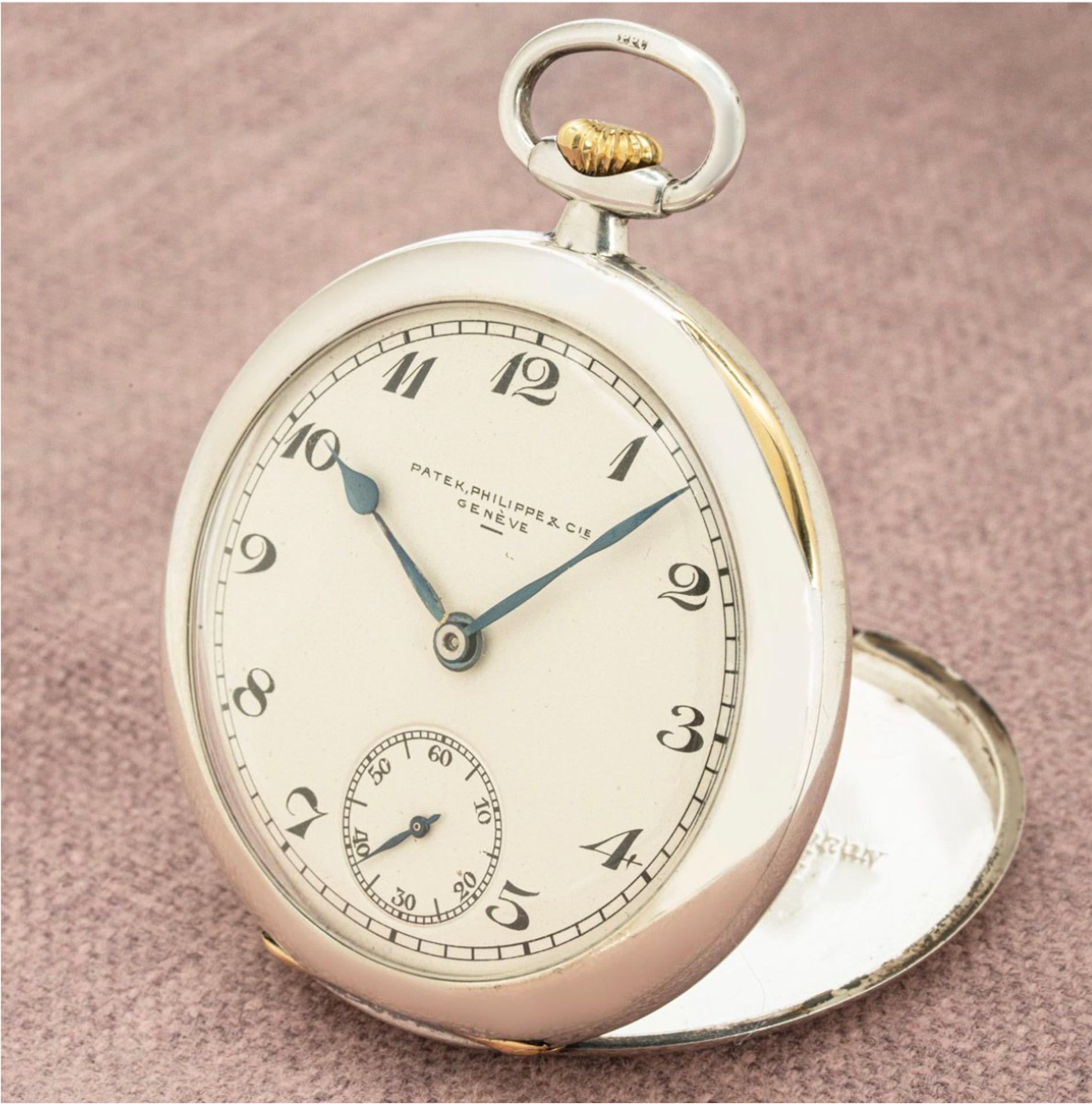 A rare Patek Philippe silver and gold, keyless lever open face dress pocket watch, C1920s.

Dial: The beautifully crisp fully signed Patek Philippe & Cie Genève silver dial with black Arabic numerals, outer minute track and subsidiary seconds dial