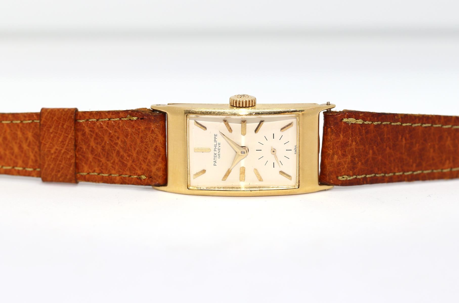 Patek Philippe Rectangular Curved Glass Ref#1593 Wristwatch in it’s original box. 

The exquisite reference 1593, also referred to by collectors as the “The Hour Glass”, was launched in 1944 and remained in production for over 20 years. Most watches