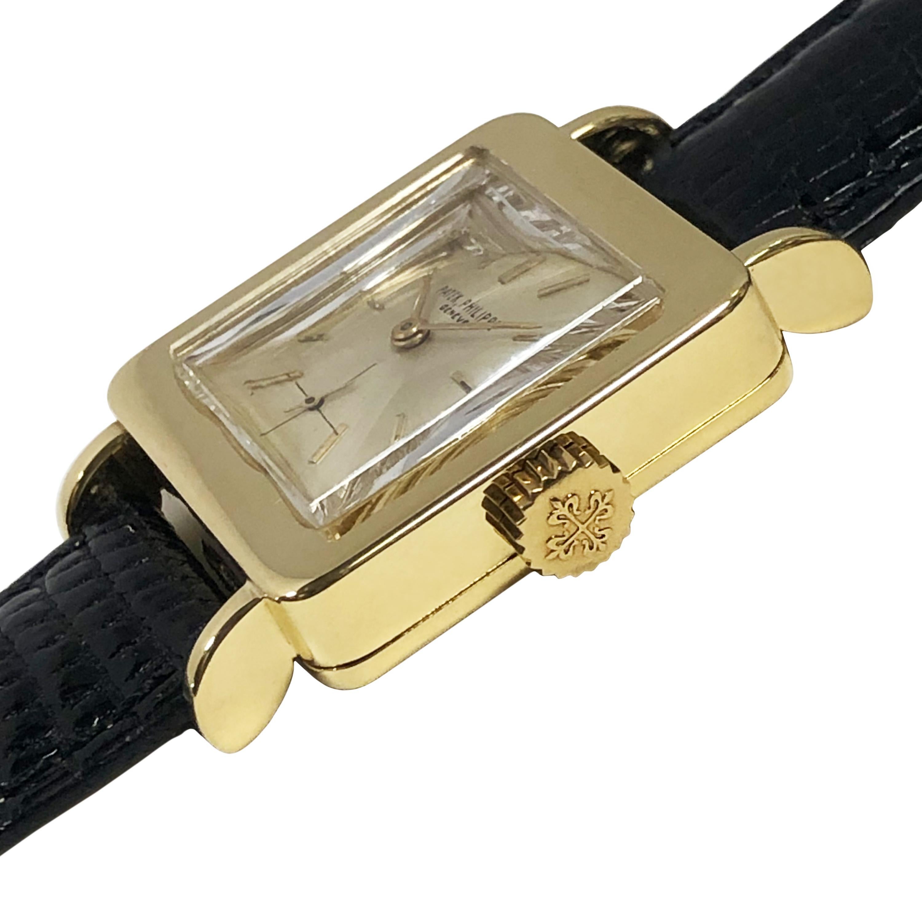 Circa 1950 Patek Philippe Wrist Watch, 36 M.M. from Lug end to end  X  26 M.M. 18K Yellow Gold 2 Piece case, 18 Jewel Mechanical, manual wind nickle lever movement, Silver Satin dial with Sub seconds chapter and raised Gold markers, original Patek