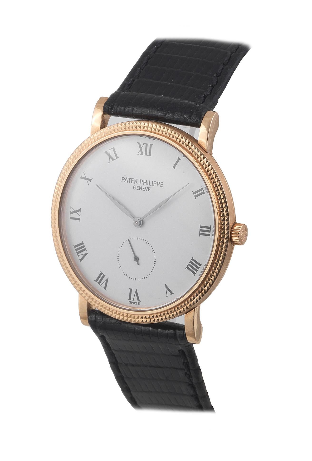 Made circa 1990. Very fine, thin and elegant, 18K rose gold.Two-body, solid, polished and brushed, hobnail decorated bezel, straight lugs, snap-on case, sapphire crystal. Porcelain white with painted radial Roman numerals, subsidiary seconds dial.