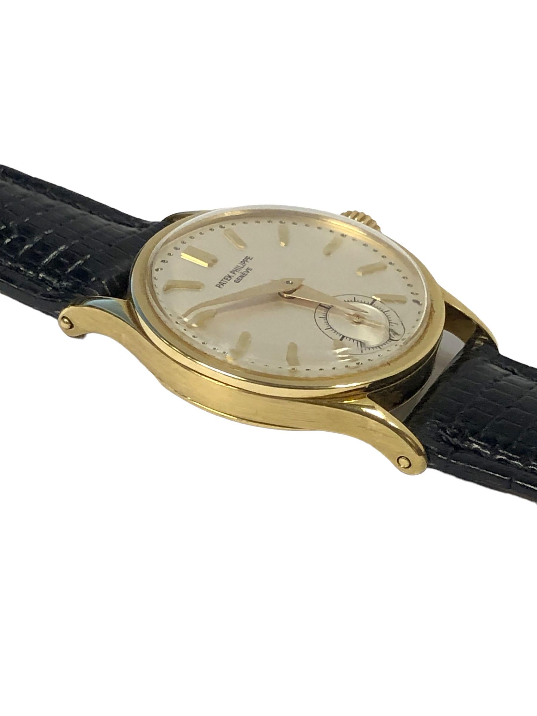 Circa 1945 Patek Philippe Reference 96 Calatrava Wrist Watch, 31 M.M. diameter x  7.5 M.M. thick 3 piece case. 18 Jewel Nickle Lever Mechanical, Manual wind movement, mint condition Silver Satin dial with Raised Gold markers and a sub seconds hand,