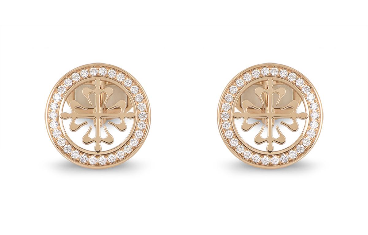 A pair of 18k rose gold Calatrava cufflinks by Patek Philippe. The cufflinks feature the classic Calatrava cross motif, surrounded with a boarder of round brilliant cut diamonds. There are 60 diamonds in total, with an approximate carat weight of
