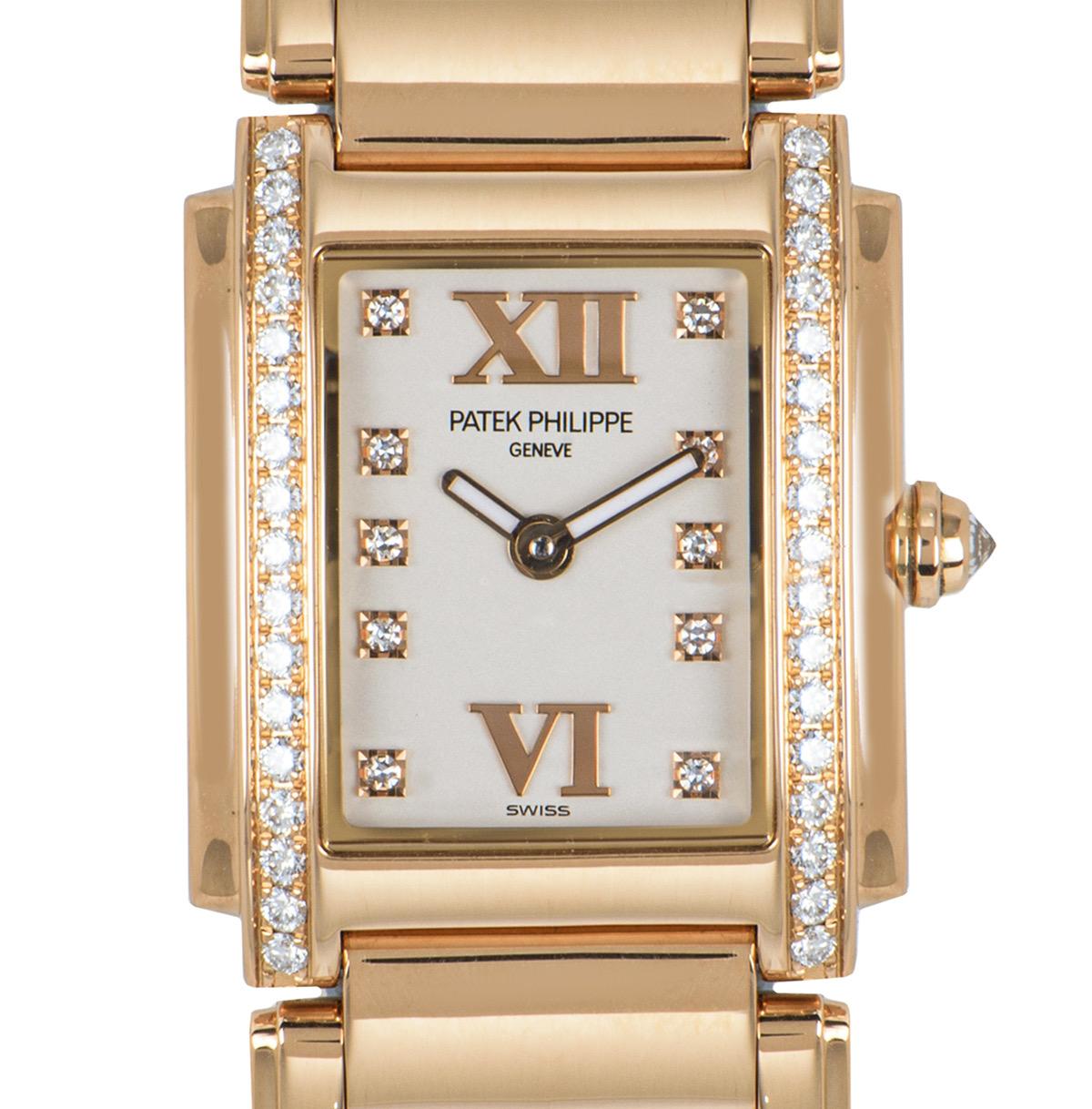 A women's Twenty-4 quartz wristwatch, made from 18k rose gold, by Patek Philippe. 

Features an opaline dial with 10 applied round brilliant cut diamond hour markers, as well as roman numerals VI and XII. Complementing the dial, the bezel is set