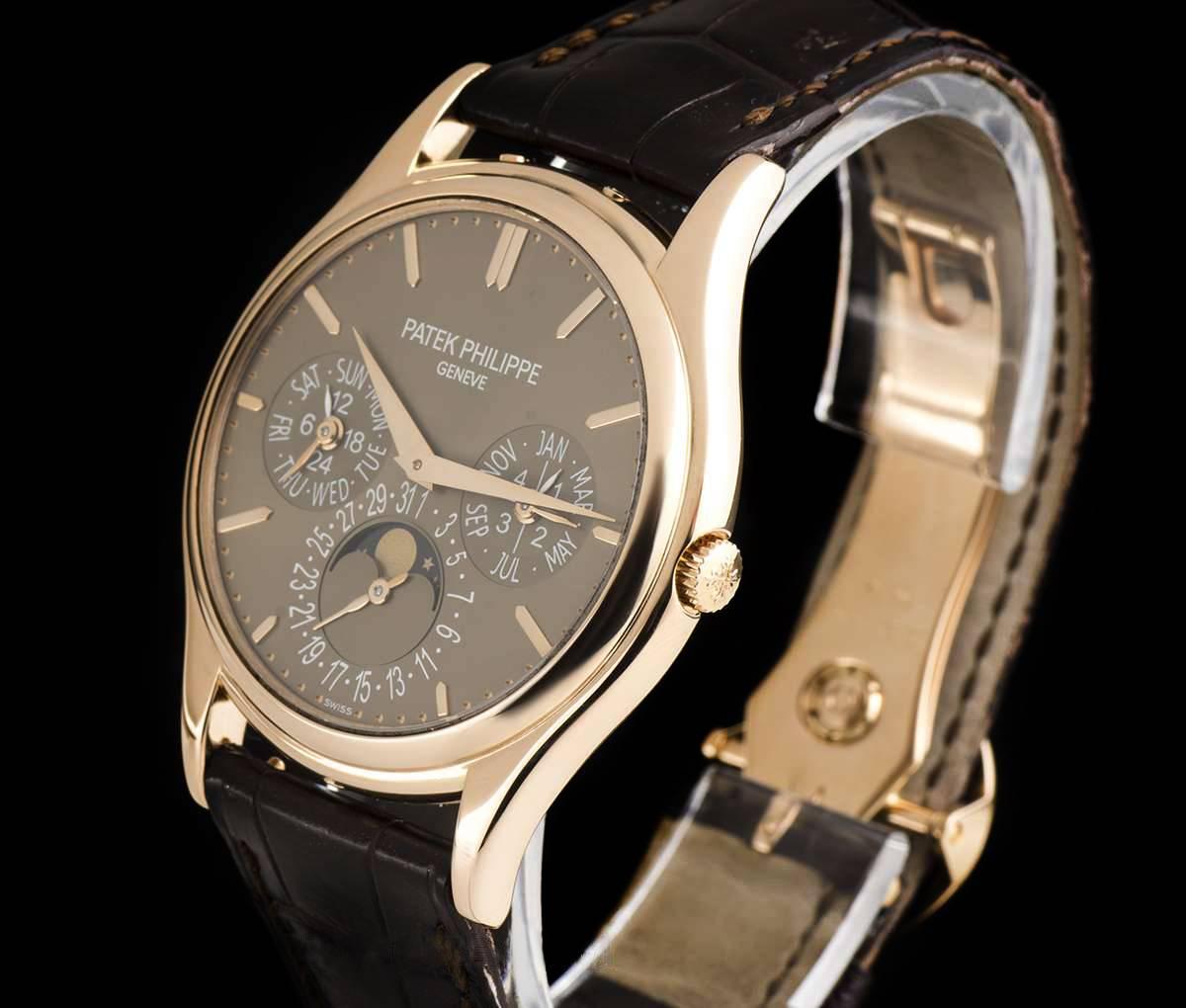An 18k Rose Gold Perpetual Calendar Ultra Thin Gents Wristwatch, brown dial with applied hour markers, minute markers on outer edge of the dial, month and leap year sub-dial at 3 0'clock, moonphase and date sub-dial at 6 0'clock, weekday and 24 hour