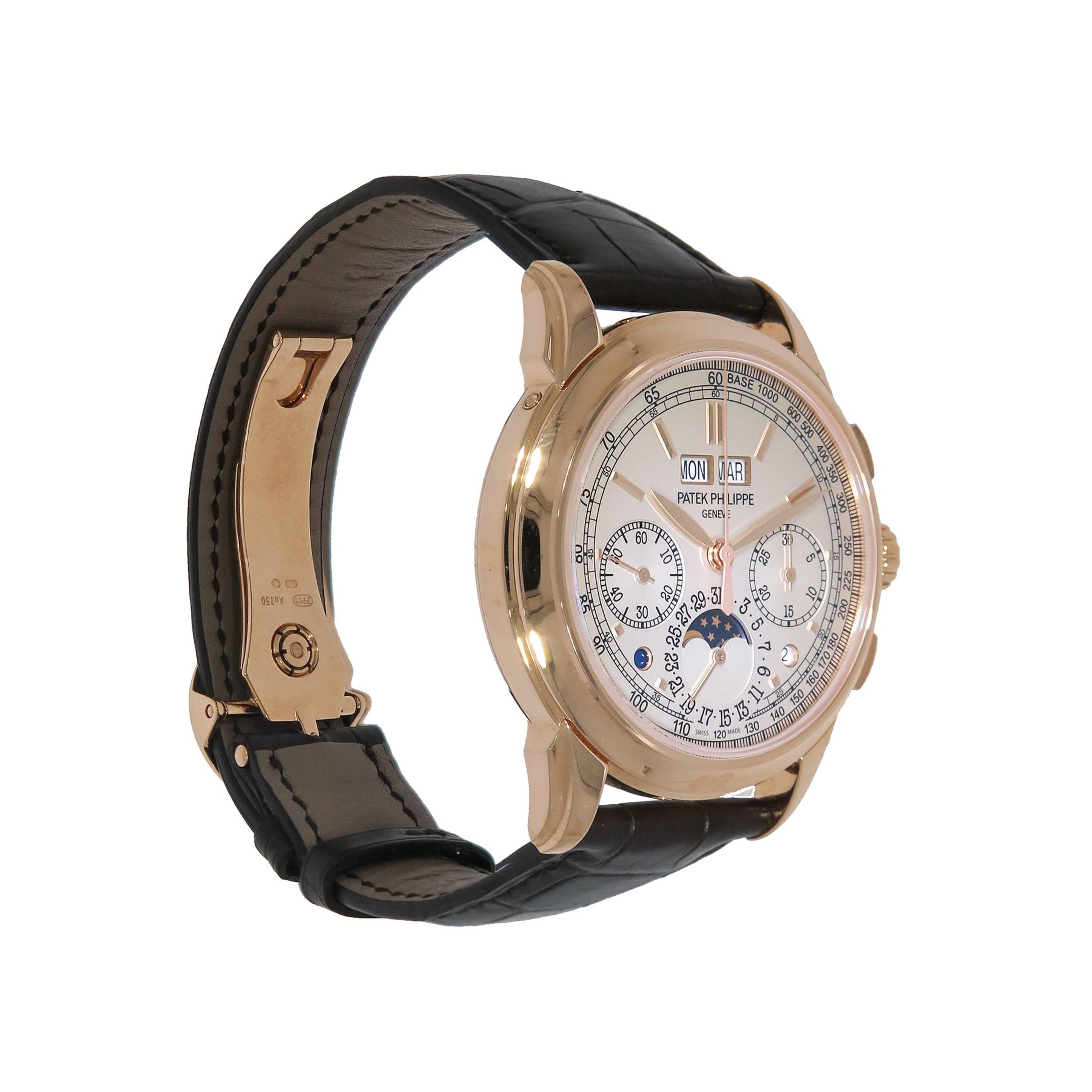 Patek Philippe Perpetual Chronograph crafted in 18k rose gold.  
This timepiece features a manually wound movement (caliber CH 29-535 PS Q)  with indications for the Hours, Minutes, Seconds, Day, Date, Month, Lunar Cycle, Day/Night, Leap Year and