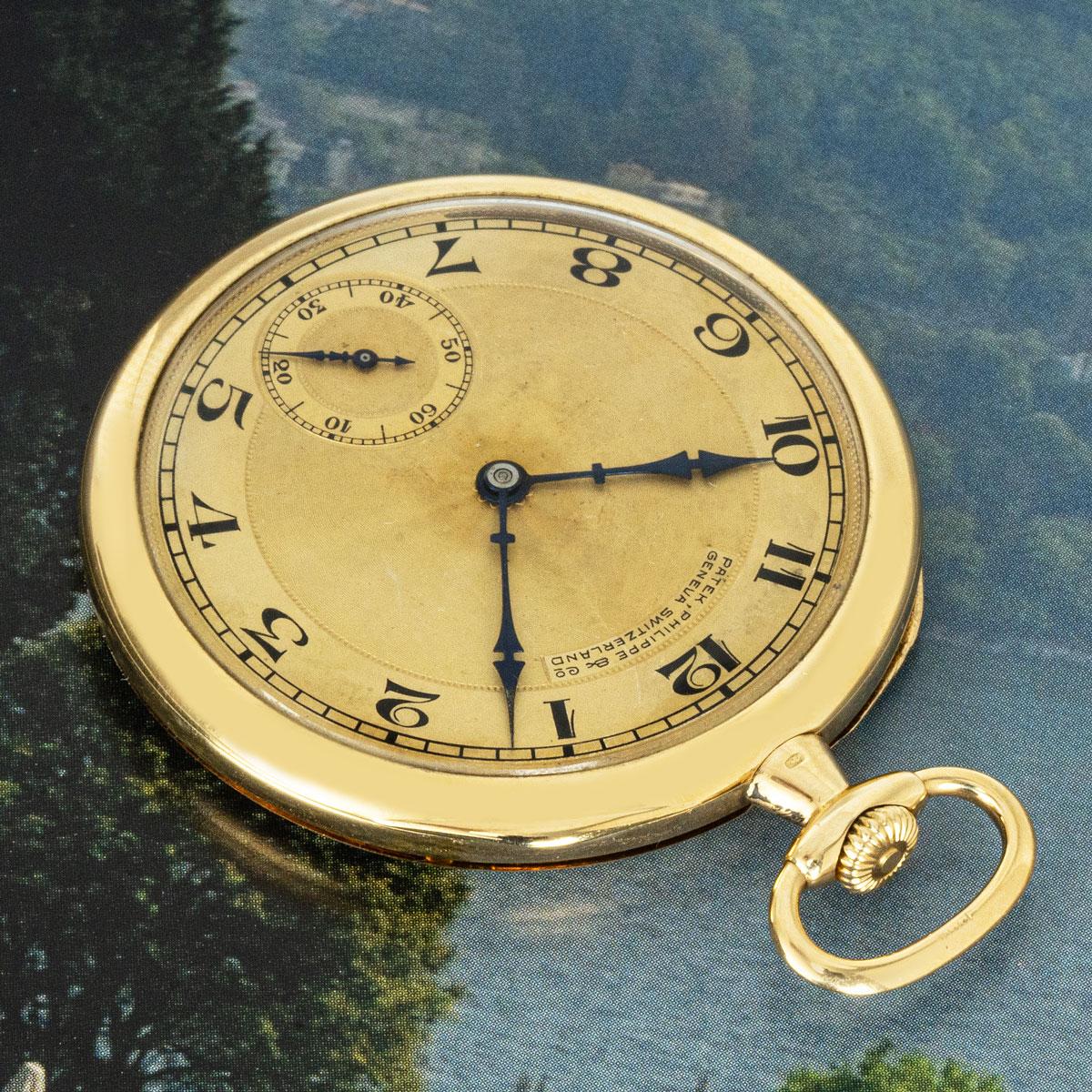 Patek Philippe. A Slim 18ct Yellow Gold keyless Lever Open Face Pocket Watch, C1916.

Dial: A Beautiful Silver Gilt engine turned Dial, fully signed Patek Philippe & Co Geneve Switzerland. The black enamel inlaid Arabic numerals with outer minute