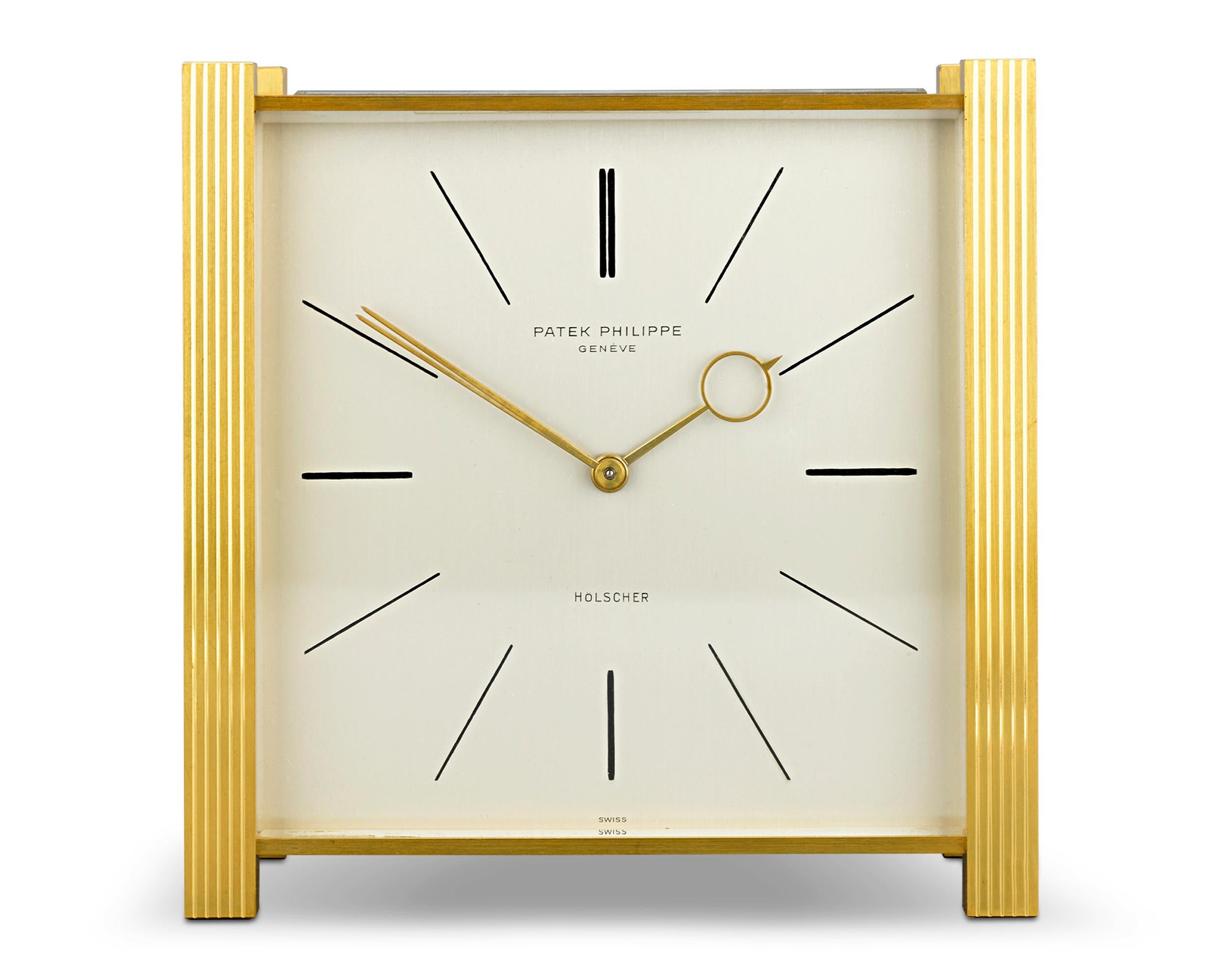 This refined circa 1965 solar desk clock by Patek Philippe exudes timeless elegance. Featuring clean lines and a simple yet dignified face emblazoned with the maker's name and that of the retailer, Holscher, this 5 1/2-inch wide square desk clock is