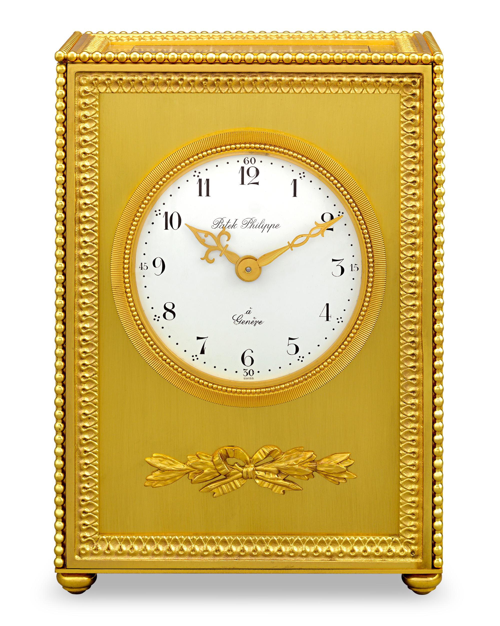 This Patek Philippe solar table clock is a rare marvel from the celebrated firm. Made out of gilded brass with an elegantly sculpted foliate and ribbon accent, this magnificent clock is as innovative as it is beautiful, as their use of solar power