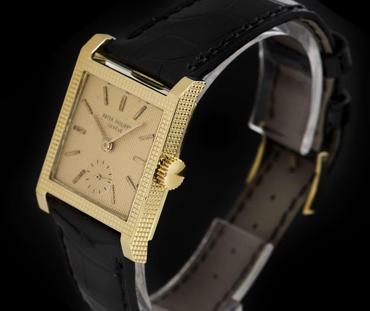 An 18k Yellow Gold Square 'Clous De Paris' Vintage Gents Dress Wristwatch, champagne dial with applied hour markers, small seconds at 6 0'clock, a fixed 18k yellow gold 'Clous De Paris' patterned bezel, an 18k yellow gold 'Clous De Paris' patterned