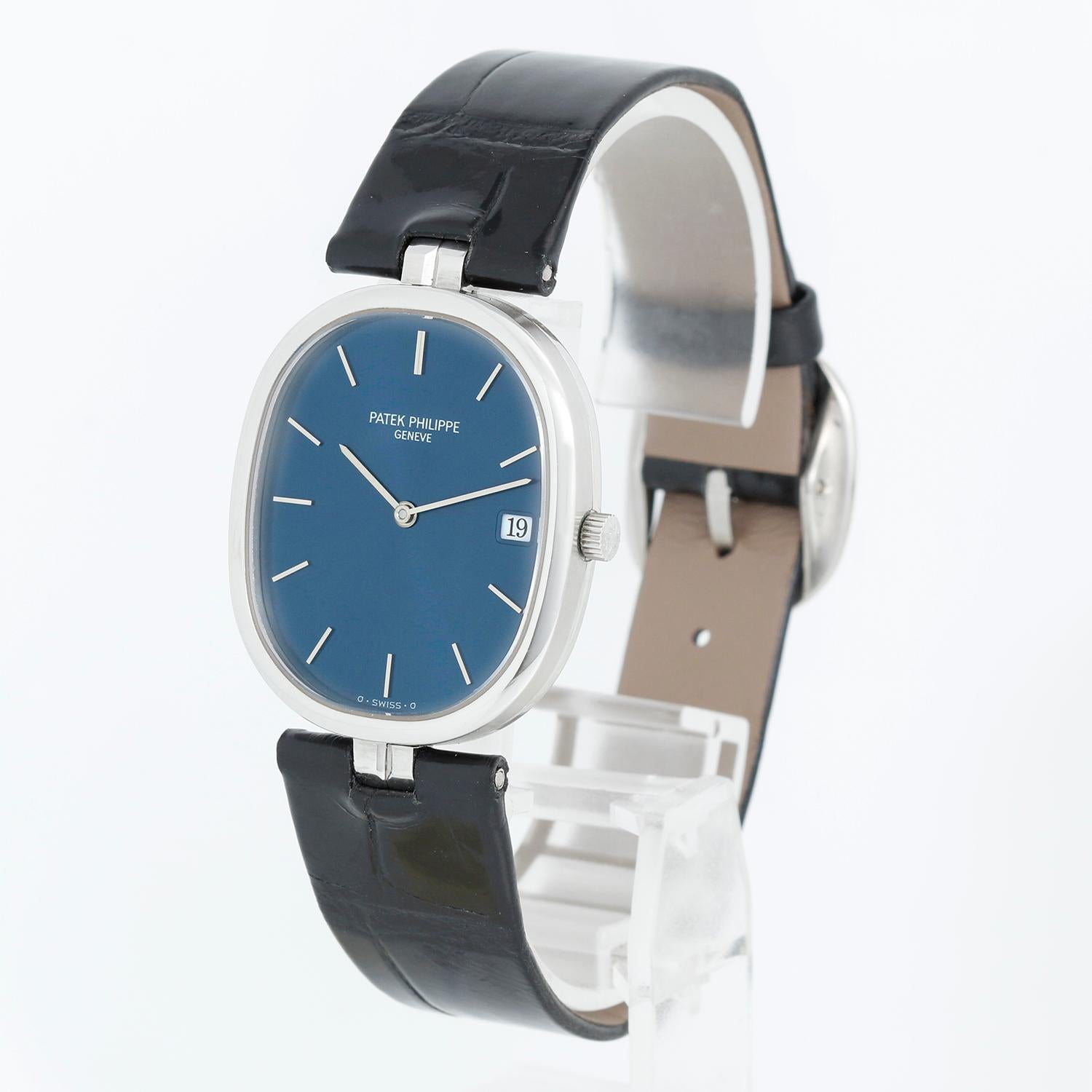 Patek Philippe Stainless Steel Ellipse Watch Ref. 3930 - Quartz. Stainless Steel case (29mm x 34 mm). Sunburst blue dial. New Patek Philippe & Co. black leather strap with signed Patek steel buckle. Pre-owned with Patek Philippe box.