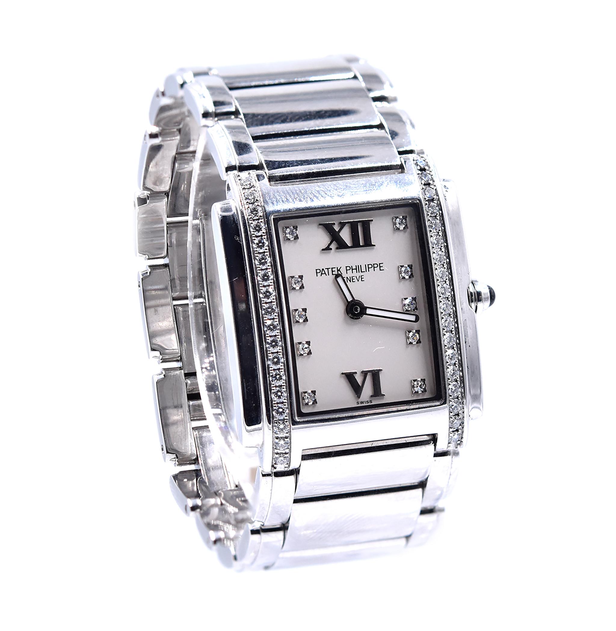 Movement: automatic
Function: hours, minuets 
Case: 25mm rectangular case, sapphire crystal, diamond bezel
Dial: white diamond dial
Band: Patek Philippe stainless steel bracelet with butterfly clasp
Reference #: 4910
Serial #: 4855XXX

Comes with