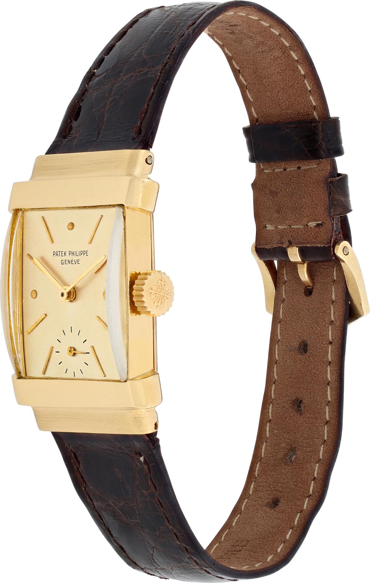 Patek Philippe Top Hat in 18k yellow gold on a brown alligator leather strap with a 18k PP tang buckle.Vintage model from the 1940s. Manual w/ subseconds. 21 mm case size. Ref 1450. Fine Pre-owned Patek Philippe Watch.

 Certified preowned Vintage