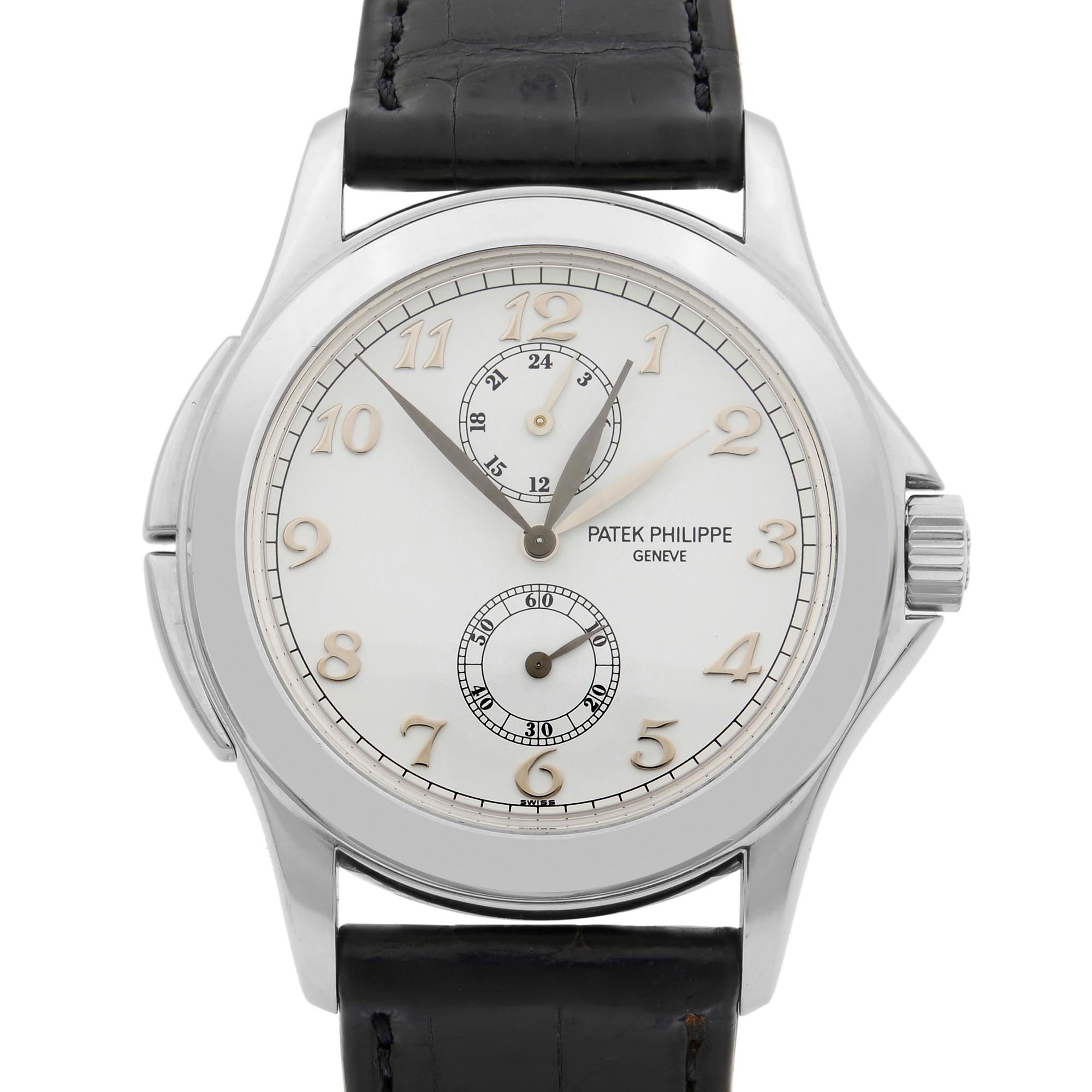 This pre-owned Patek Philippe Travel Time 5134G is a beautiful men's timepiece that is powered by mechanical (hand-winding) movement which is cased in a white gold case. It has a round shape face, GMT, multiple time zones, small seconds subdial dial