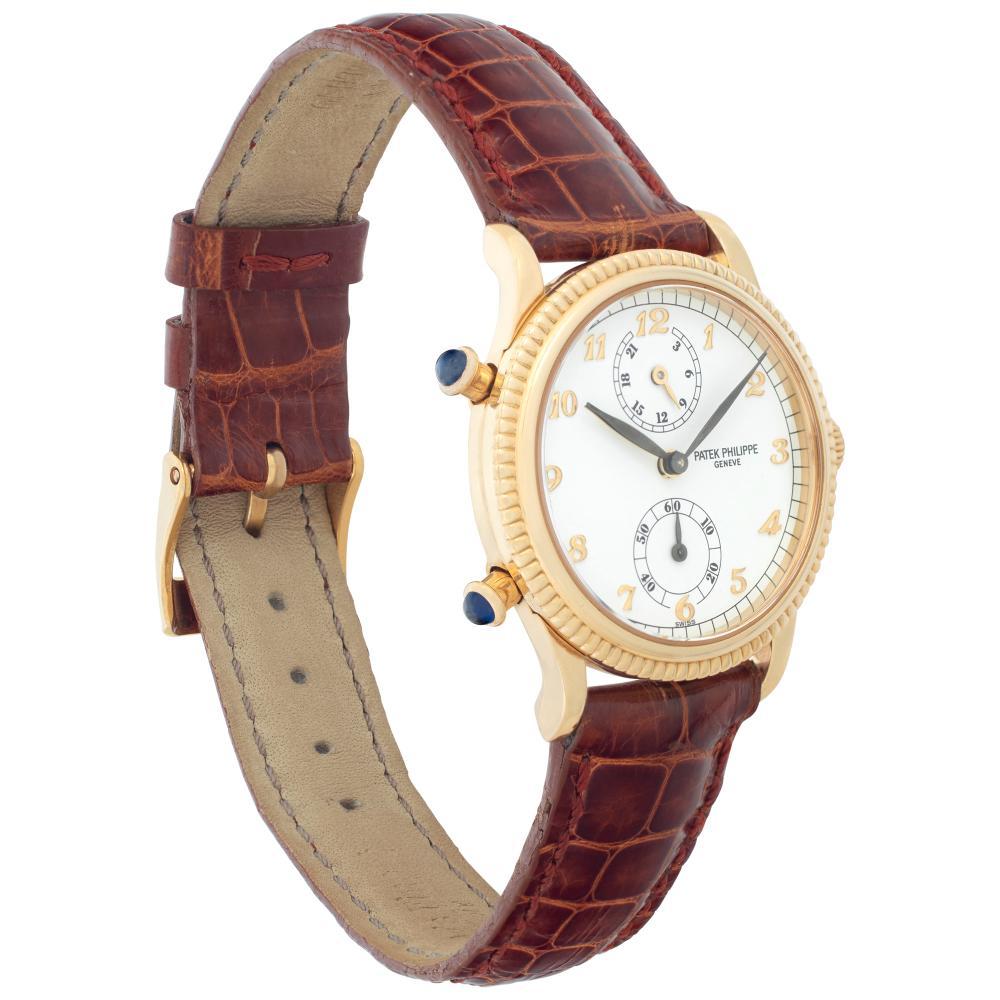 Patek Philippe Travel Time 4864j yellow gold w/ a White dial 29.5mm Manual watch In Excellent Condition In Surfside, FL