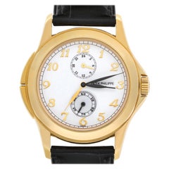 Patek Philippe Travel Time 5134J-001, White Dial, Certified