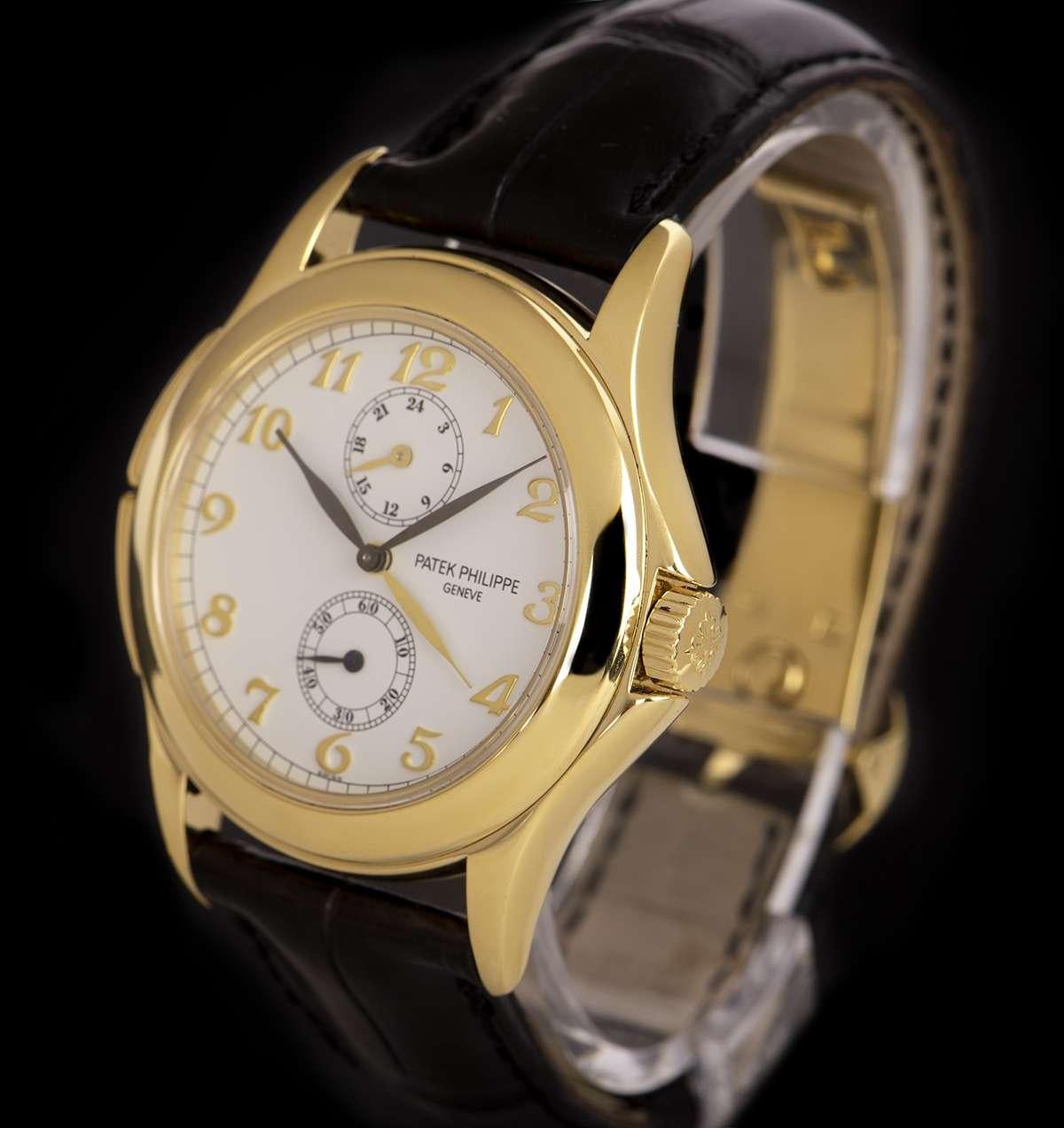 An 18k Yellow Gold Travel Time Gents Wristwatch, white dial with 18k yellow gold applied arabic numbers, small seconds at 6 0'clock, 24 hour second time zone at 12 0'clock, a fixed 18k yellow gold bezel, push button at 8 0'clock advances the local