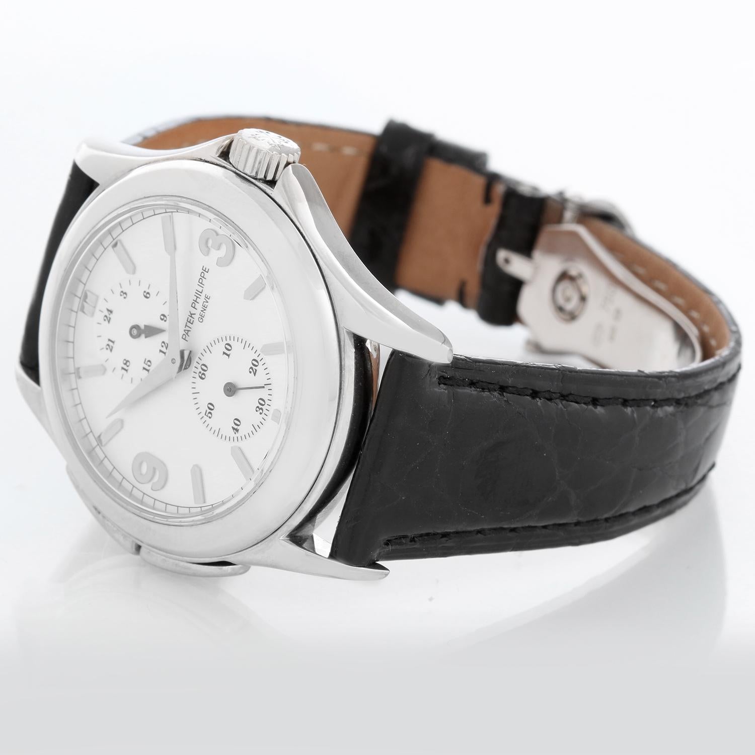 Patek Philippe Travel Time Men's 18k White Gold Watch 5134 G In Excellent Condition In Dallas, TX