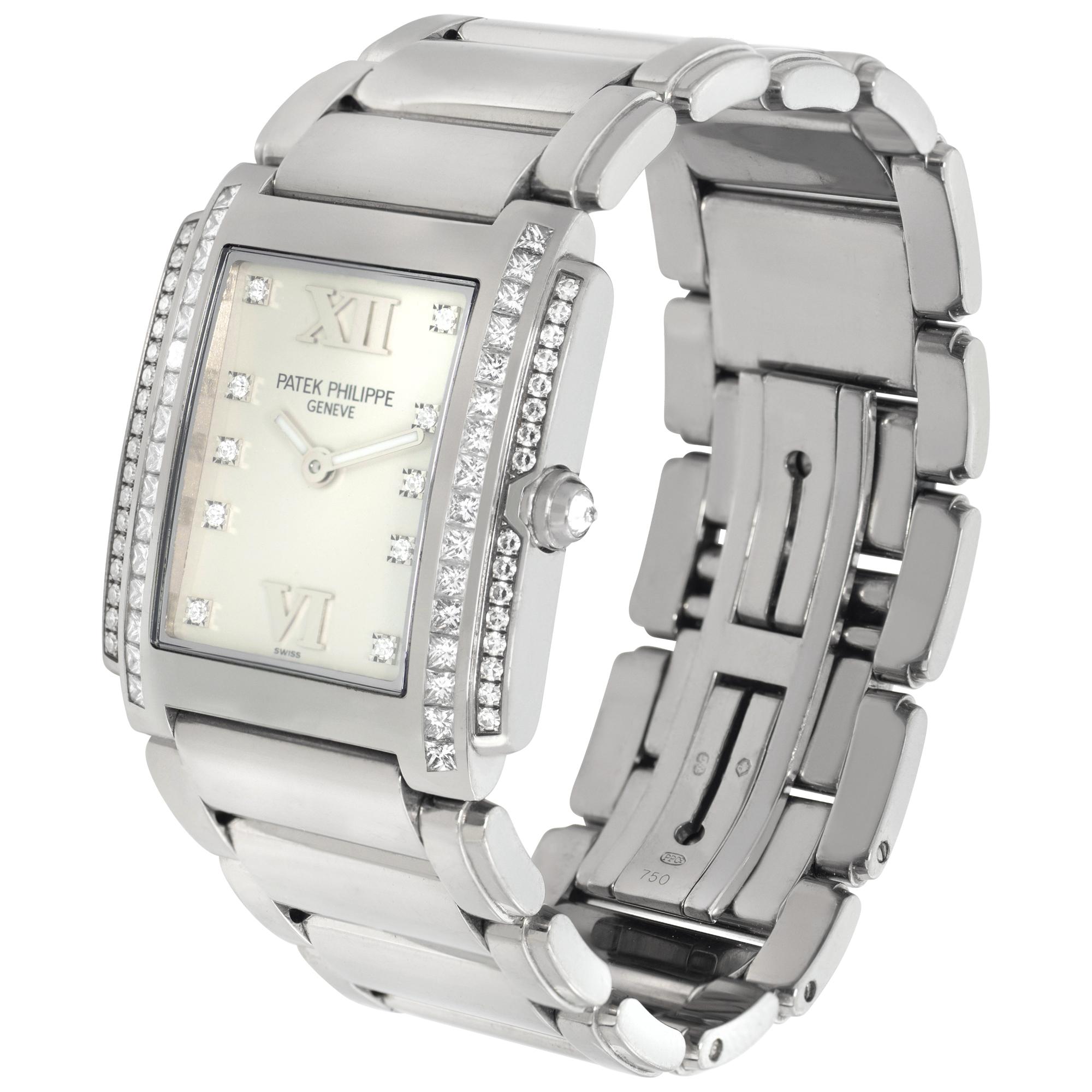 Patek Philippe Twenty-4 in 18k white gold with double row of diamonds on case (two rows of princess cut diamonds and two rows of brilliant round diamonds), diamond crown and diamond dial. Quartz. 29.5 mm length (lug to lug) by 25 mm width case size.