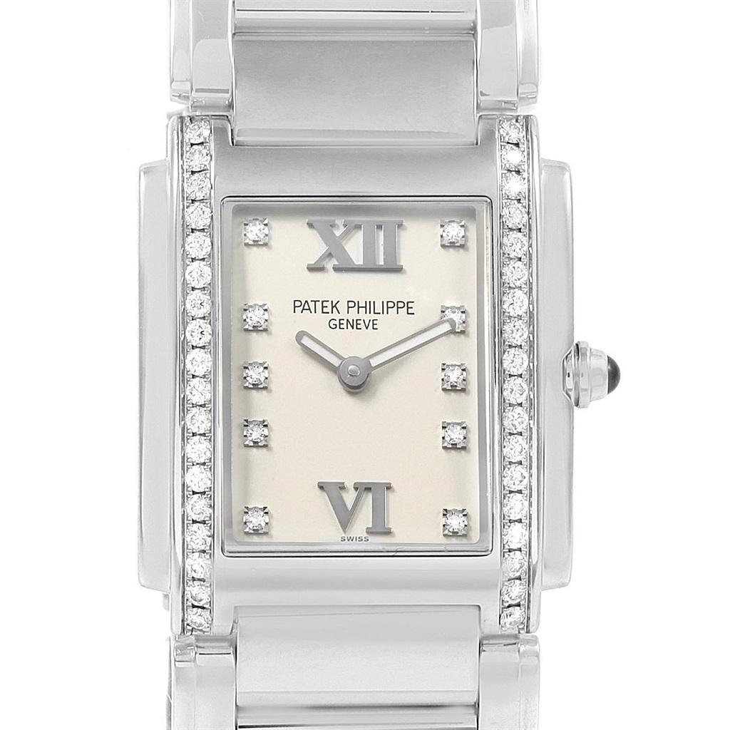 Patek Philippe Twenty-4 Diamond Ladies Quartz Watch 4910/10A-010. Quartz movement. Stainless steel case 25.0 x 30.0 mm. Onyx set crown. Original Patek factory 38 diamond bezel. Scratch resistant sapphire crystal. Silver dial with original Patek
