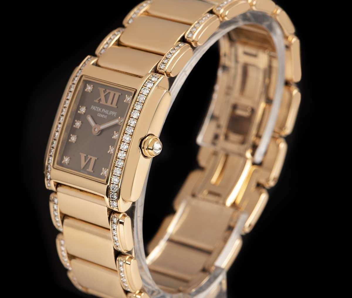 An 18k Rose Gold Twenty-4 Ladies Wristwatch, brown dial with 10 applied round brilliant cut diamond hour markers and applied roman numerals 