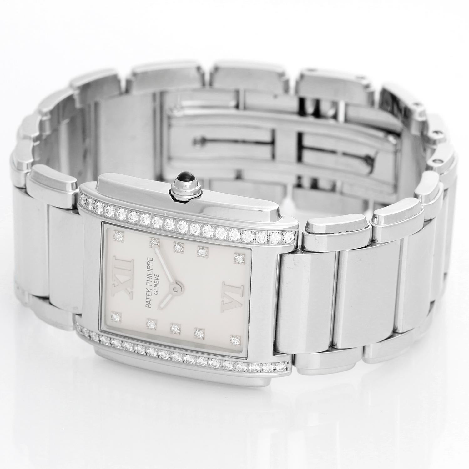 Patek Philippe Twenty-4 Ladies Steel & Diamond Watch 4910/10 - Quartz. Stainless steel set with 36 diamonds. Silver dial with diamond markers and Roman numerals. Stainless steel Patek Philippe bracelet with deployant clasp. Pre-owned with Patek