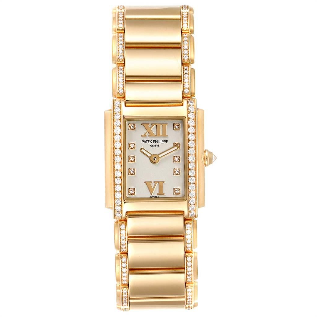 Patek Philippe Twenty-4 Small 18K Rose Gold Diamond Ladies Watch 4908. Quartz movement. 18K rose gold case 22.0 x 26.3 mm incrusted with one row of 34 Top Wesselton quality diamonds weighing approximately 0.43 carats. The crown set with the a single