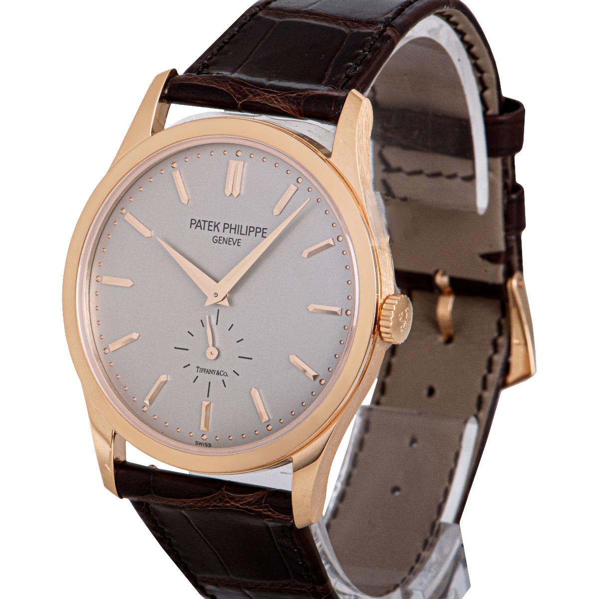 An Unworn 18k Rose Gold 37mm Calatrava Men's Wristwatch, double name Tiffany & Co. silvery gray dial with applied hour markers, small seconds at 60'clock, a fixed 18k rose gold bezel, an original chocolate brown leather strap with an original 18k