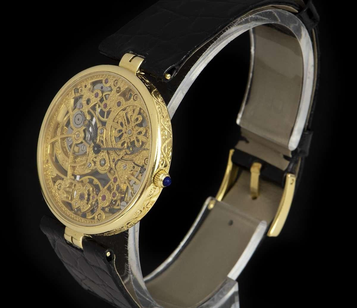 A Very Rare 18k Yellow Gold Skeleton Gents Wristwatch, skeleton dial, a fixed 18k yellow gold bezel, a brand new original black leather strap with an original 18k yellow gold pin buckle, sapphire glass, exhibition caseback, automatic movement, in