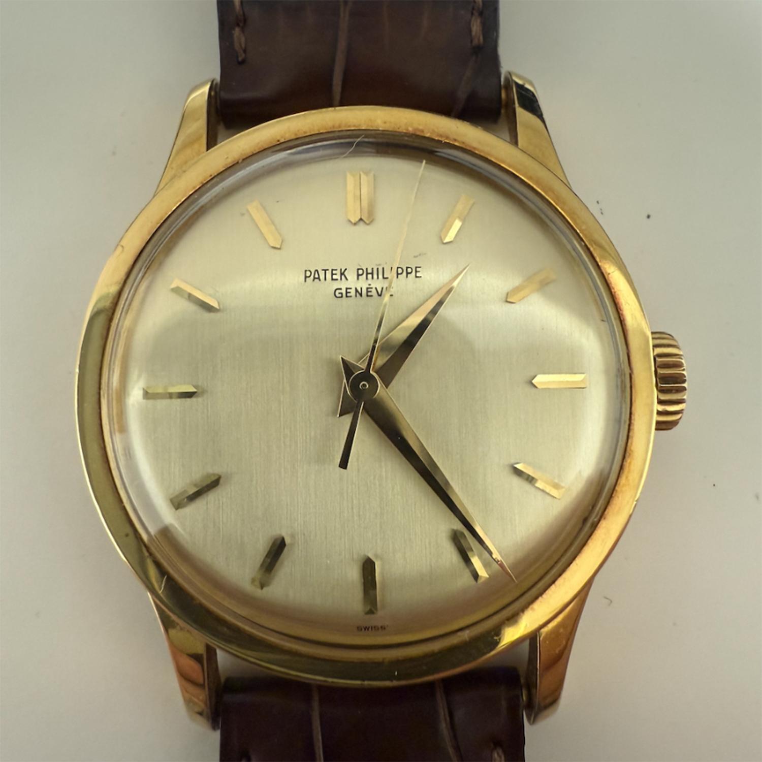 Patek Philippe Vintage Calatrava Men's Gold Watch Ref. 570 - Manual wind, Caliber 27 SC. 18K Yellow Gold Case (35.5mm). Silver dial with gold markers. Strap band with 18k gold Patek buckle. Pre-owned with Patek box and archive papers. Dated Nov. of
